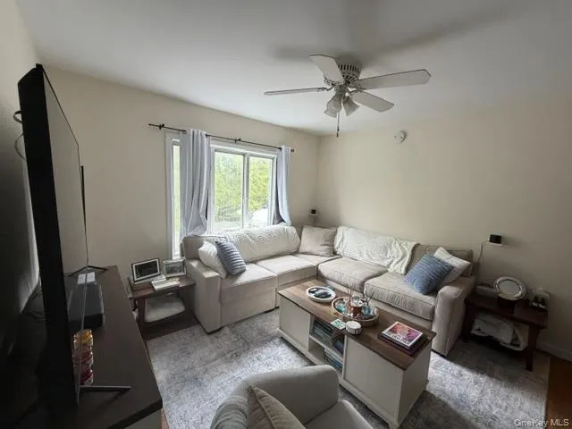 Recessed lighting, ceiling fan with integrated light fixture, window with outdoor views, light-toned wall paint, wood-finish flooring visible Recessed lighting, ceiling fan with integrated light fixture, window with outdoor views, light-toned wall paint, wood-finish flooring visible