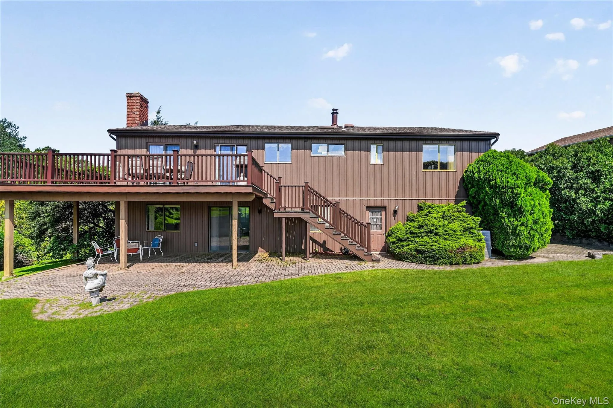 View of the back of the home, deck and patio. View of the back of the home, deck and patio.