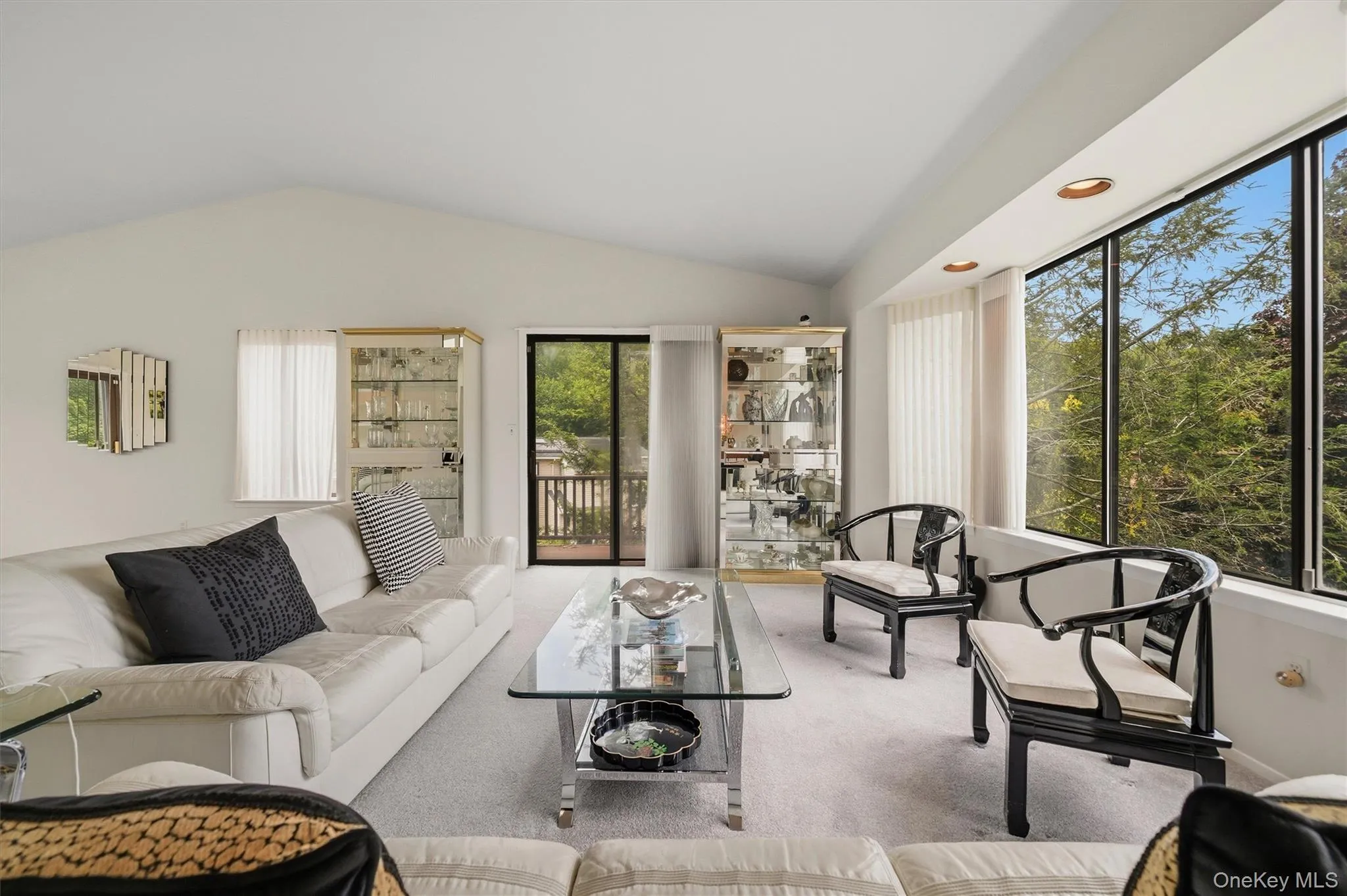 Sliding glass doors to a partially wrap around deck. Sliding glass doors to a partially wrap around deck.