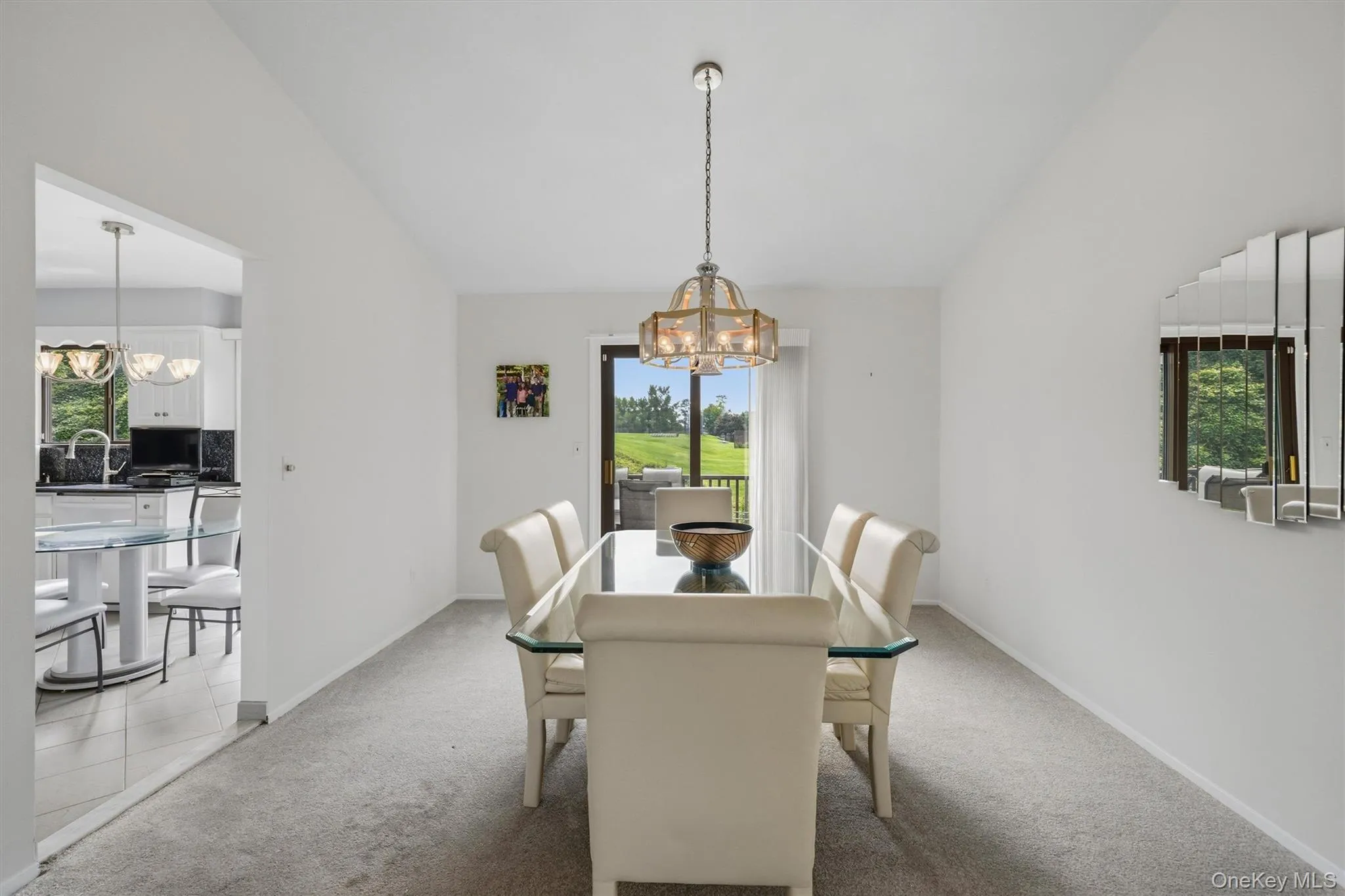 Very large dining room with another set of sliding glass doors to the deck to facilitate easy entertaining! Very large dining room with another set of sliding glass doors to the deck to facilitate easy entertaining!