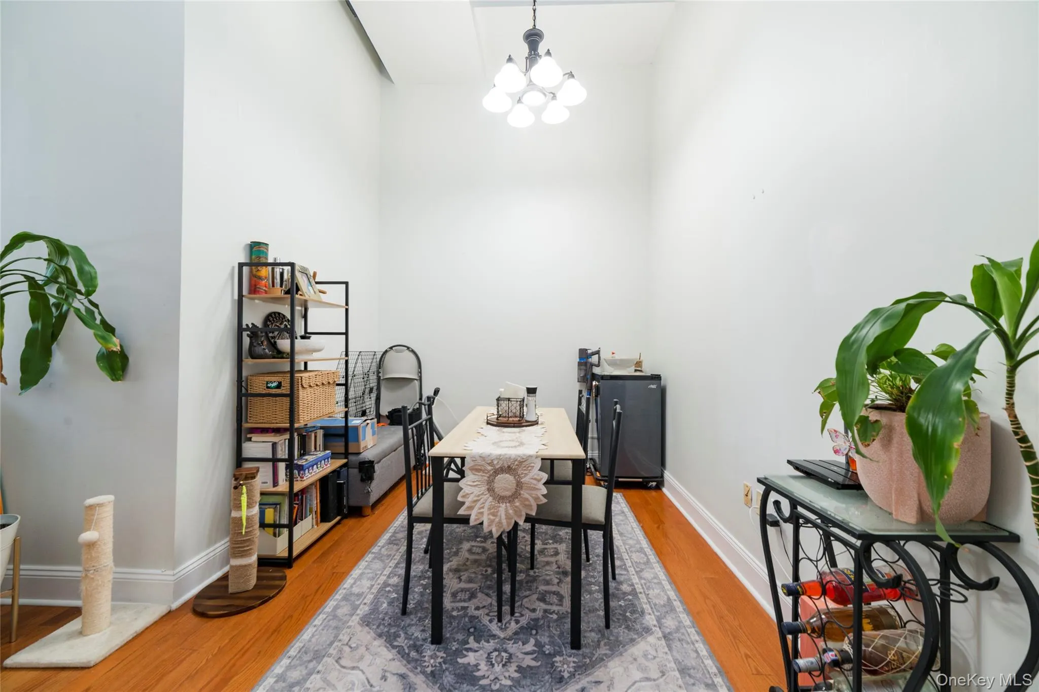 Dedicated dining space with dramatic ceiling height, modern lighting and hardwood floors Dedicated dining space with dramatic ceiling height, modern lighting and hardwood floors