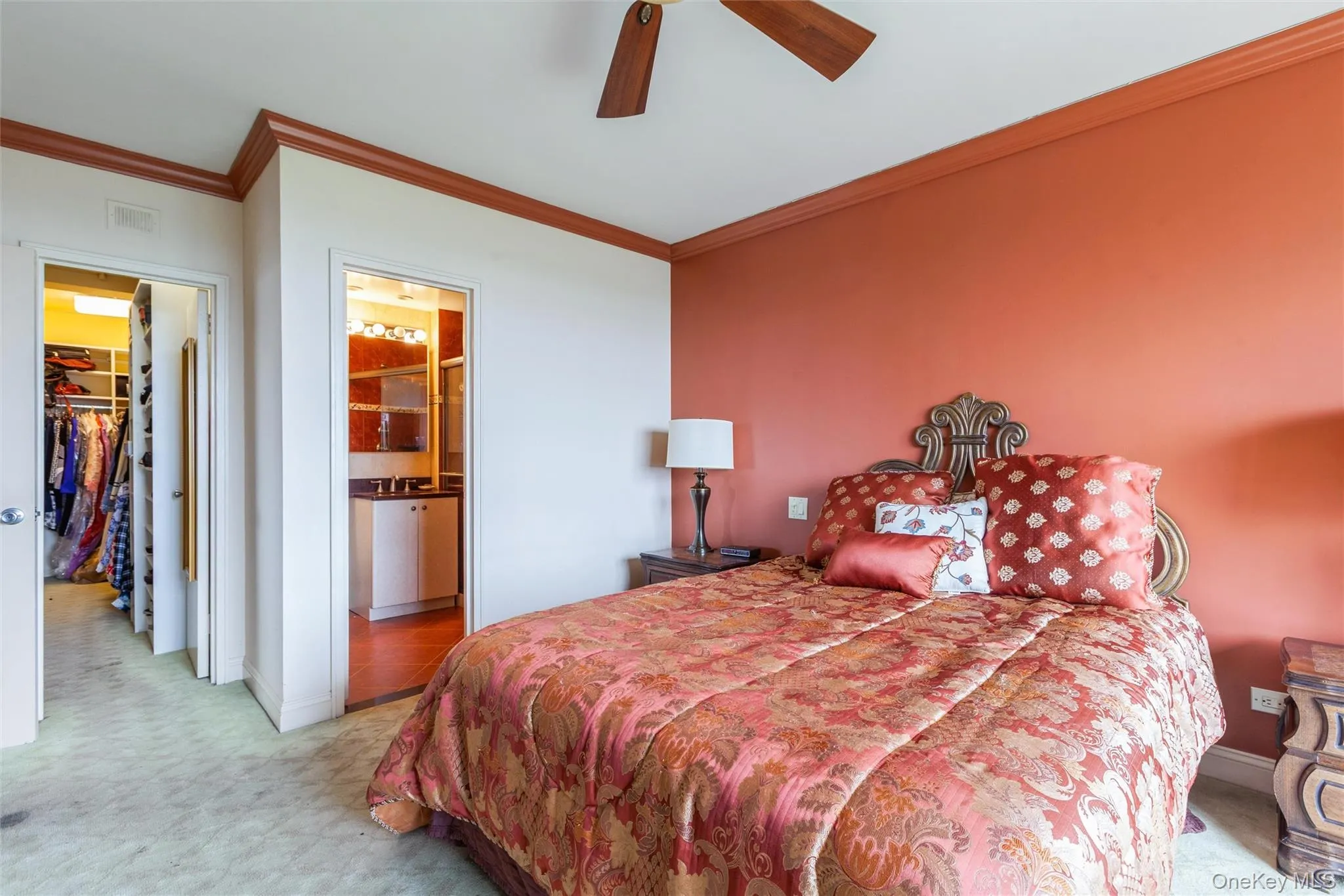 Primary bedroom with full bathroom and large walk in closet Primary bedroom with full bathroom and large walk in closet