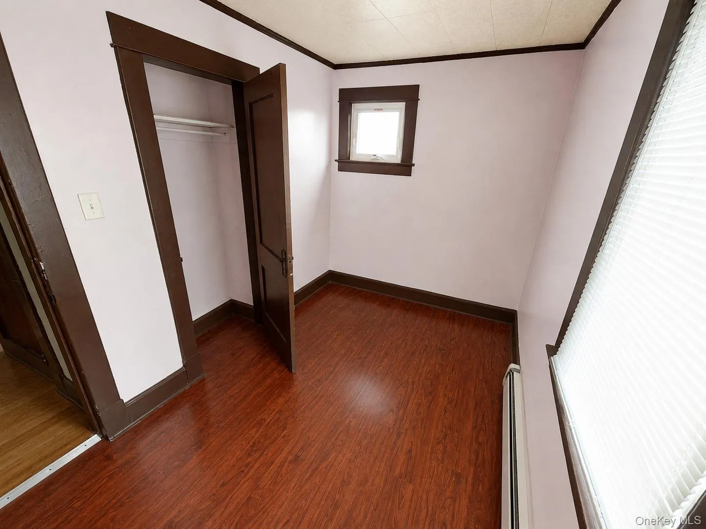 Wood-finish flooring with dark trim details Wood-finish flooring with dark trim details