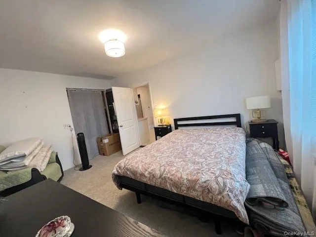 Bedroom featuring light colored carpet Bedroom featuring light colored carpet