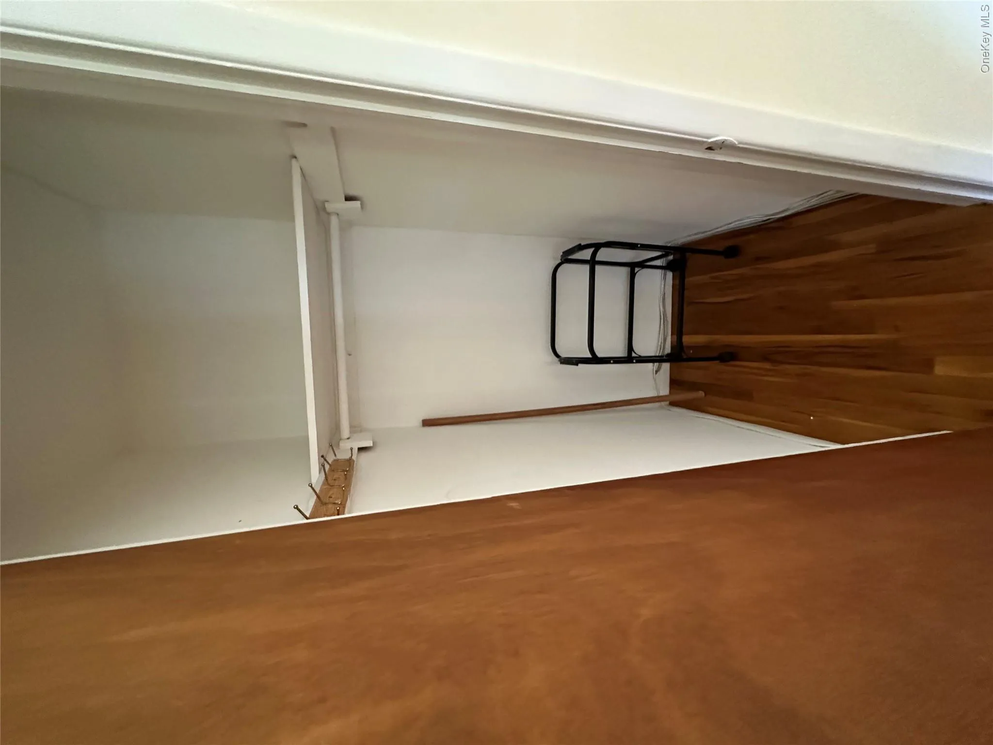 Integrated shelving and hanging rod with wood-finish flooring Integrated shelving and hanging rod with wood-finish flooring