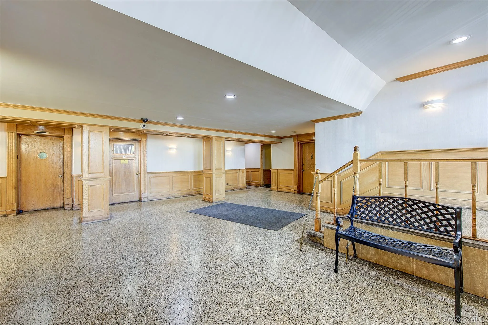 Basement featuring wainscoting, a decorative wall, and recessed lighting Basement featuring wainscoting, a decorative wall, and recessed lighting
