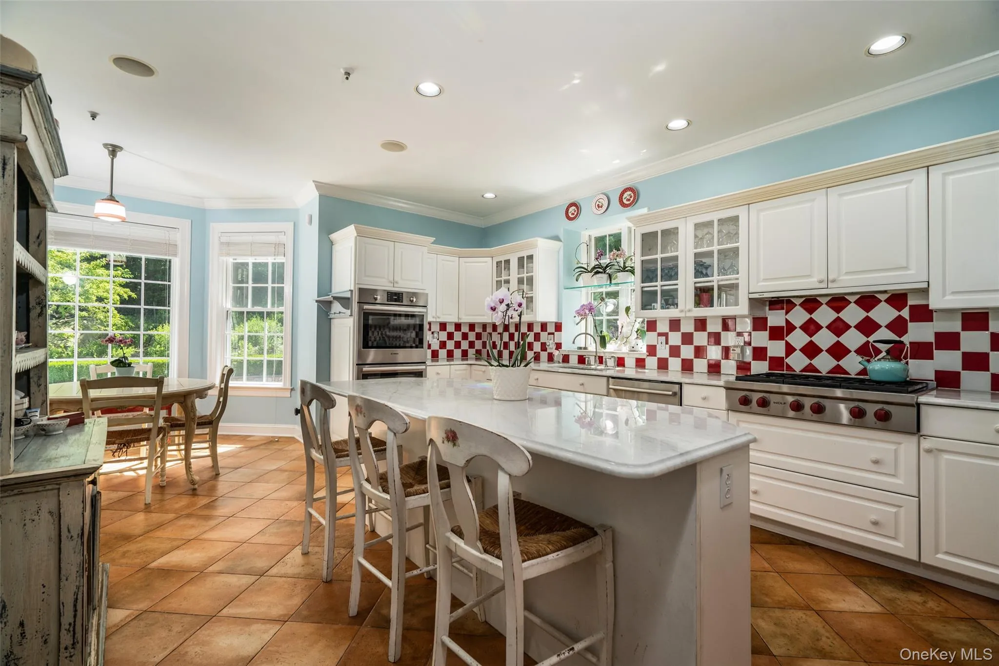 The heart of the home is light, bright, and ready for anything. With a chef-inspired island and elegant details, this kitchen flows seamlessly into a breakfast space that puts your pool and garden views front and center. The heart of the home is light, bright, and ready for anything. With a chef-inspired island and elegant details, this kitchen flows seamlessly into a breakfast space that puts your pool and garden views front and center.