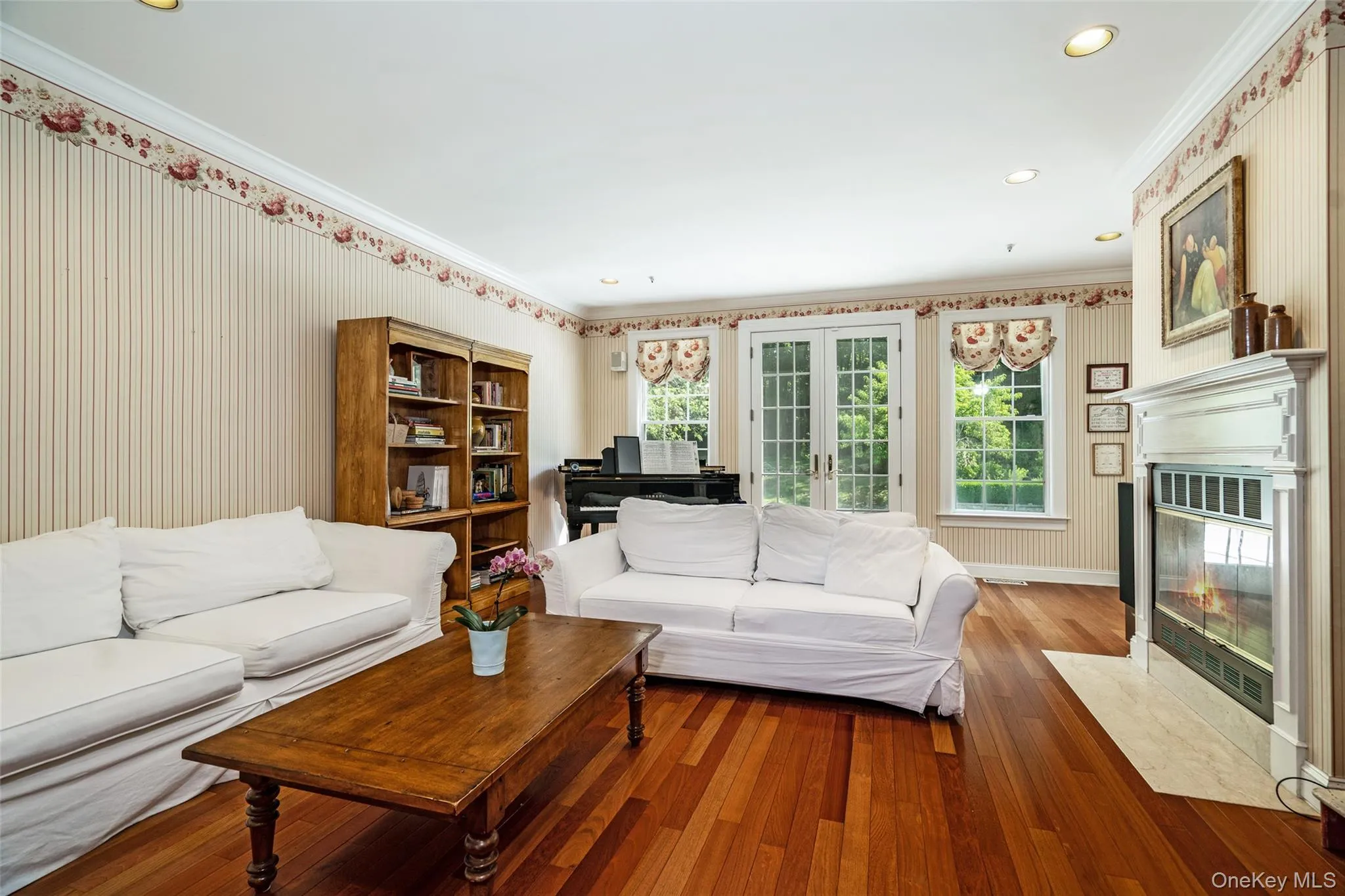 Designed for the way you actually live, this family room is where connection happens. The wood-burning fireplace adds instant ambiance, while the direct access to the patio and pool makes the whole first floor feel like one seamless space perfect for any size gathering. Designed for the way you actually live, this family room is where connection happens. The wood-burning fireplace adds instant ambiance, while the direct access to the patio and pool makes the whole first floor feel like one seamless space perfect for any size gathering.