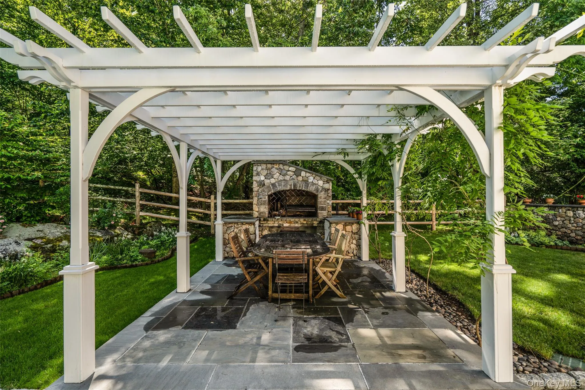 An outdoor fireplace overlooking your pool. Doesn't get any better than this! An outdoor fireplace overlooking your pool. Doesn't get any better than this!