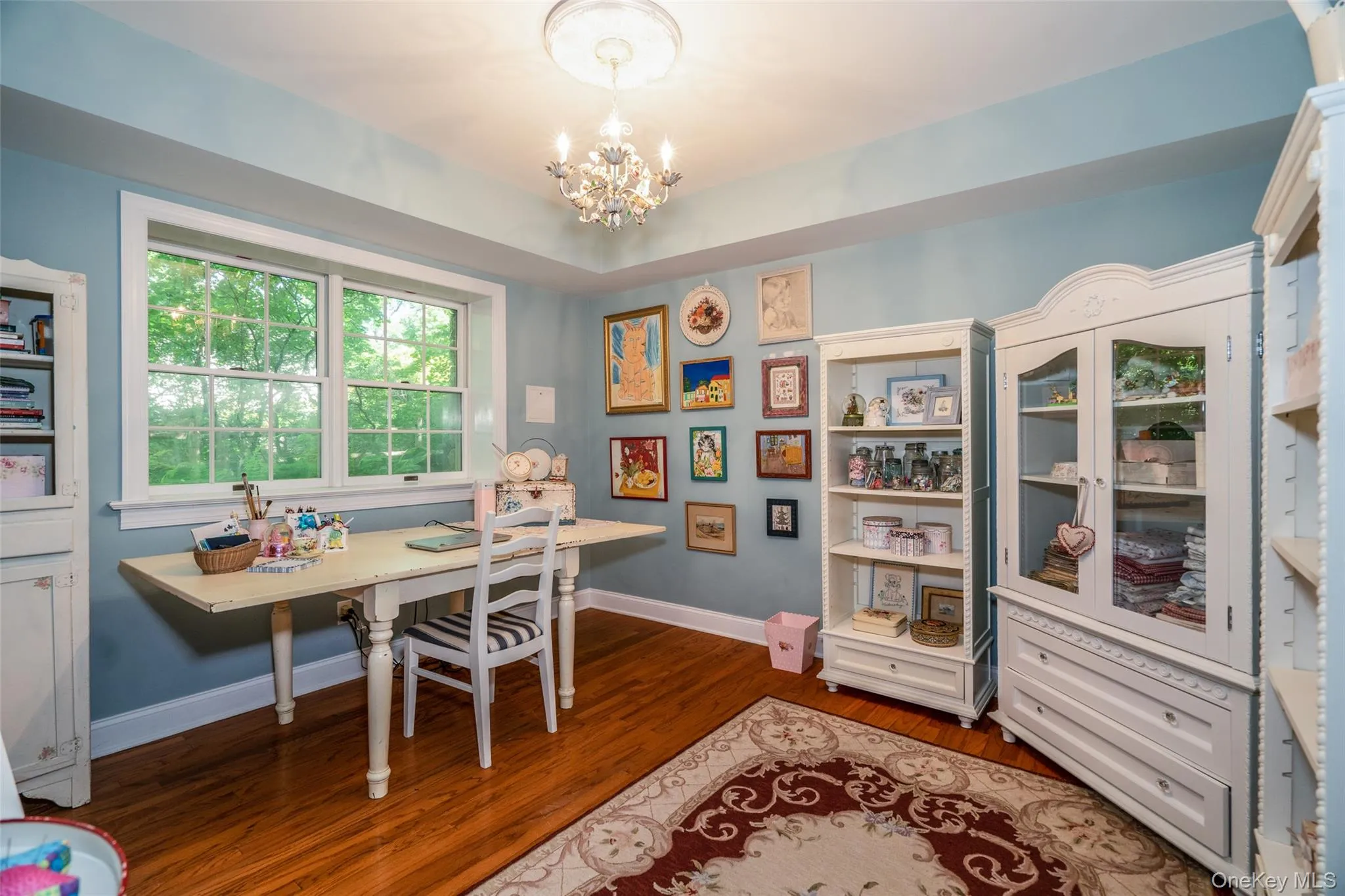 Lower level bedroom, currently being used as a craft room. Lower level bedroom, currently being used as a craft room.