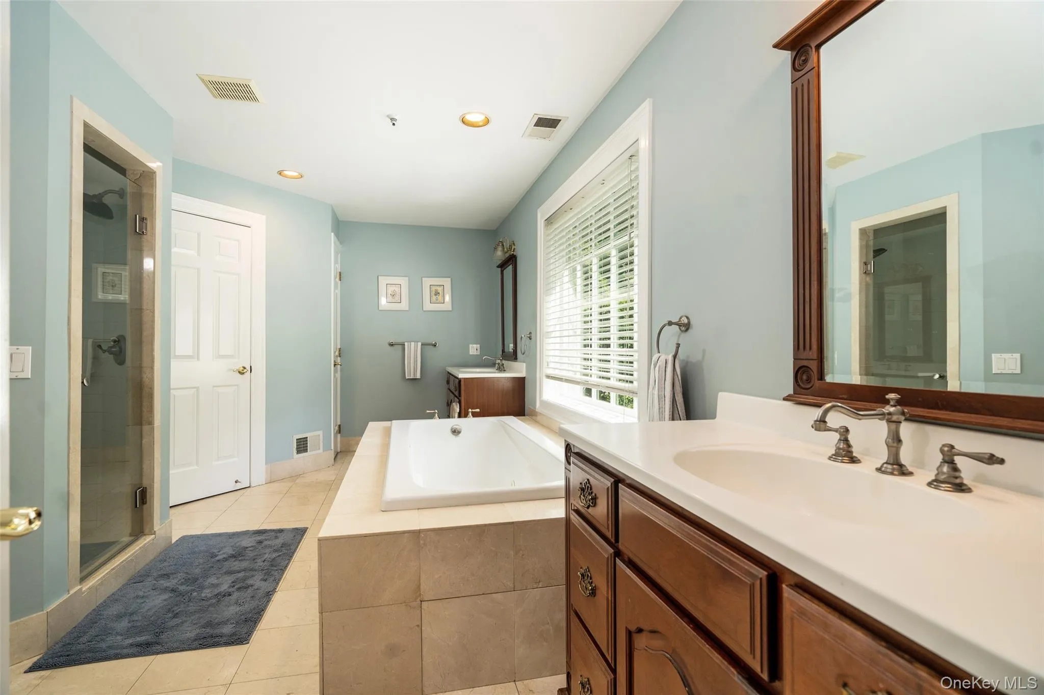Your morning prep just got a lot easier. With a private water closet, thoughtful storage throughout, and a spacious walk-in closet, this primary bathroom brings together function and comfort effortlessly. Your morning prep just got a lot easier. With a private water closet, thoughtful storage throughout, and a spacious walk-in closet, this primary bathroom brings together function and comfort effortlessly.