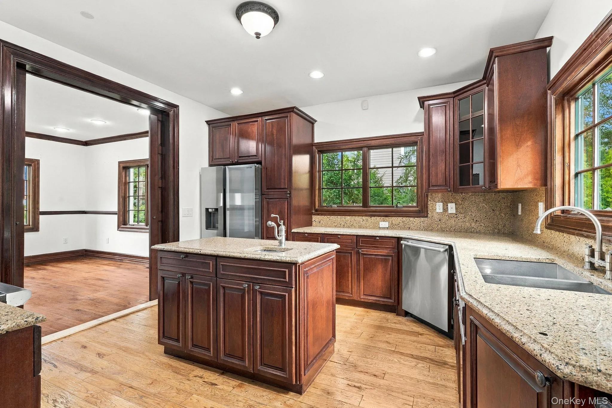 Rich cherry cabinetry brings warmth to the kitchen. Rich cherry cabinetry brings warmth to the kitchen.