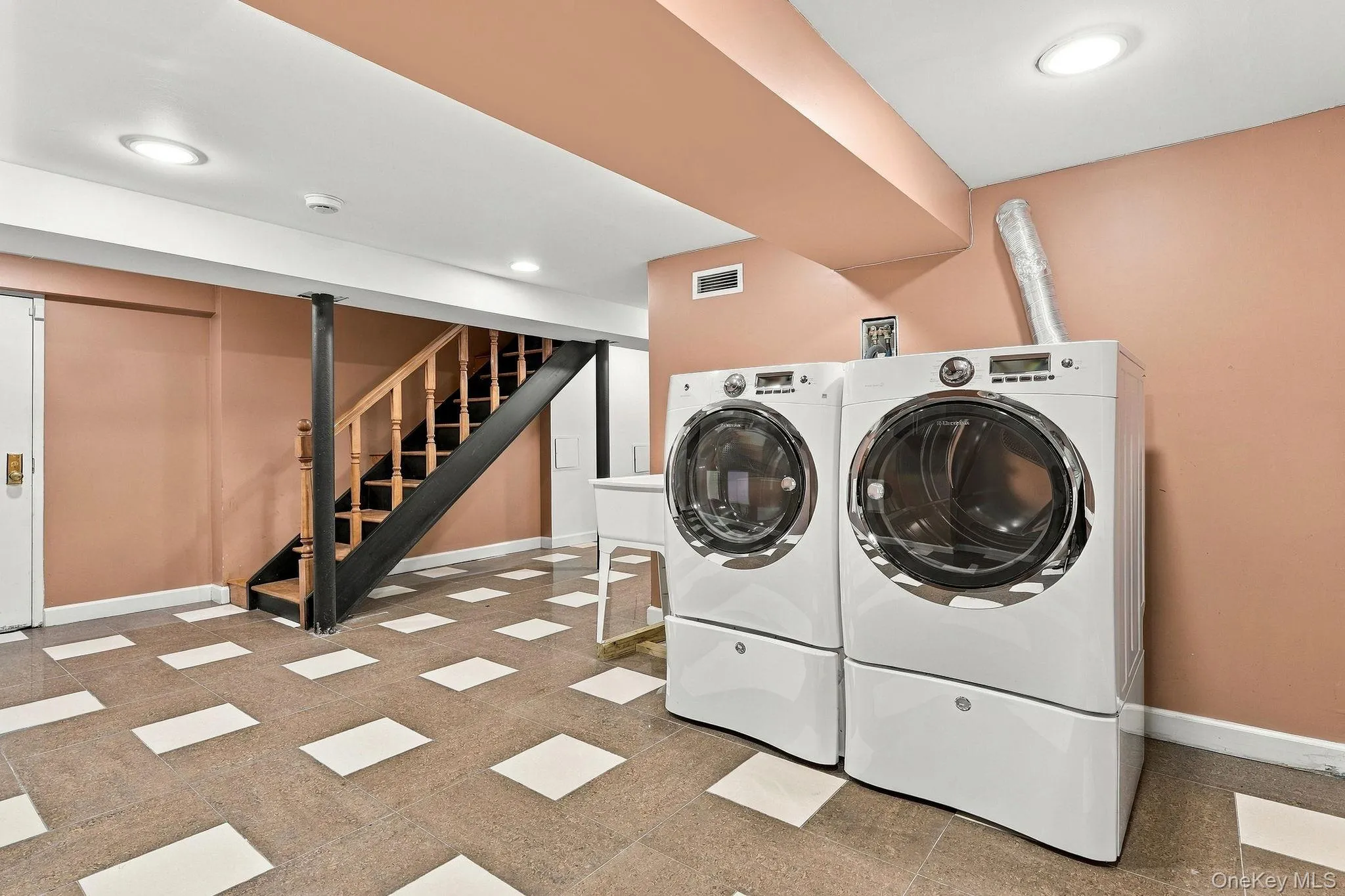A beautifully finished lower level with dedicated laundry and ample utility space. A beautifully finished lower level with dedicated laundry and ample utility space.