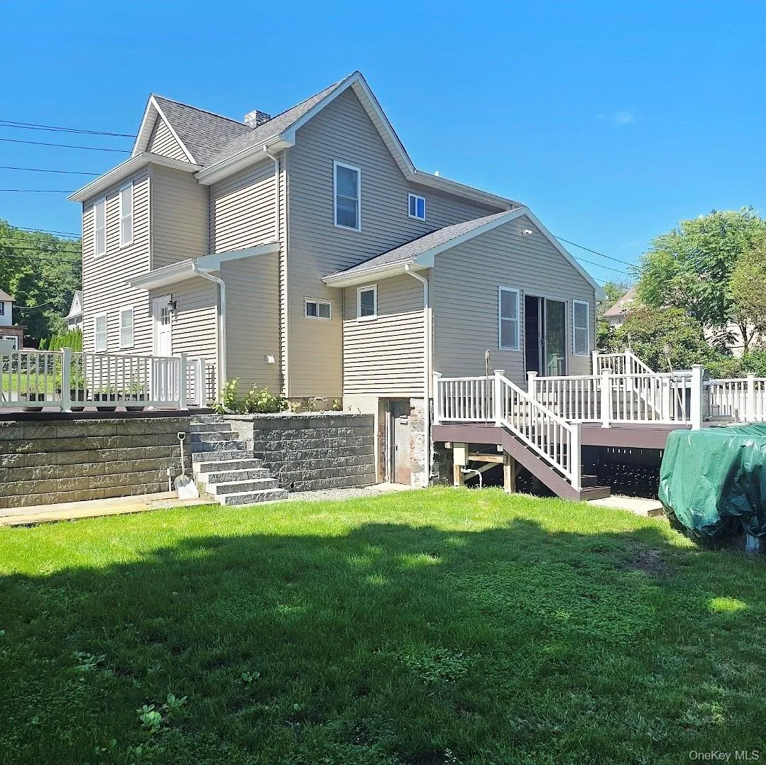 Vinyl-sided exterior with a gabled roof Vinyl-sided exterior with a gabled roof