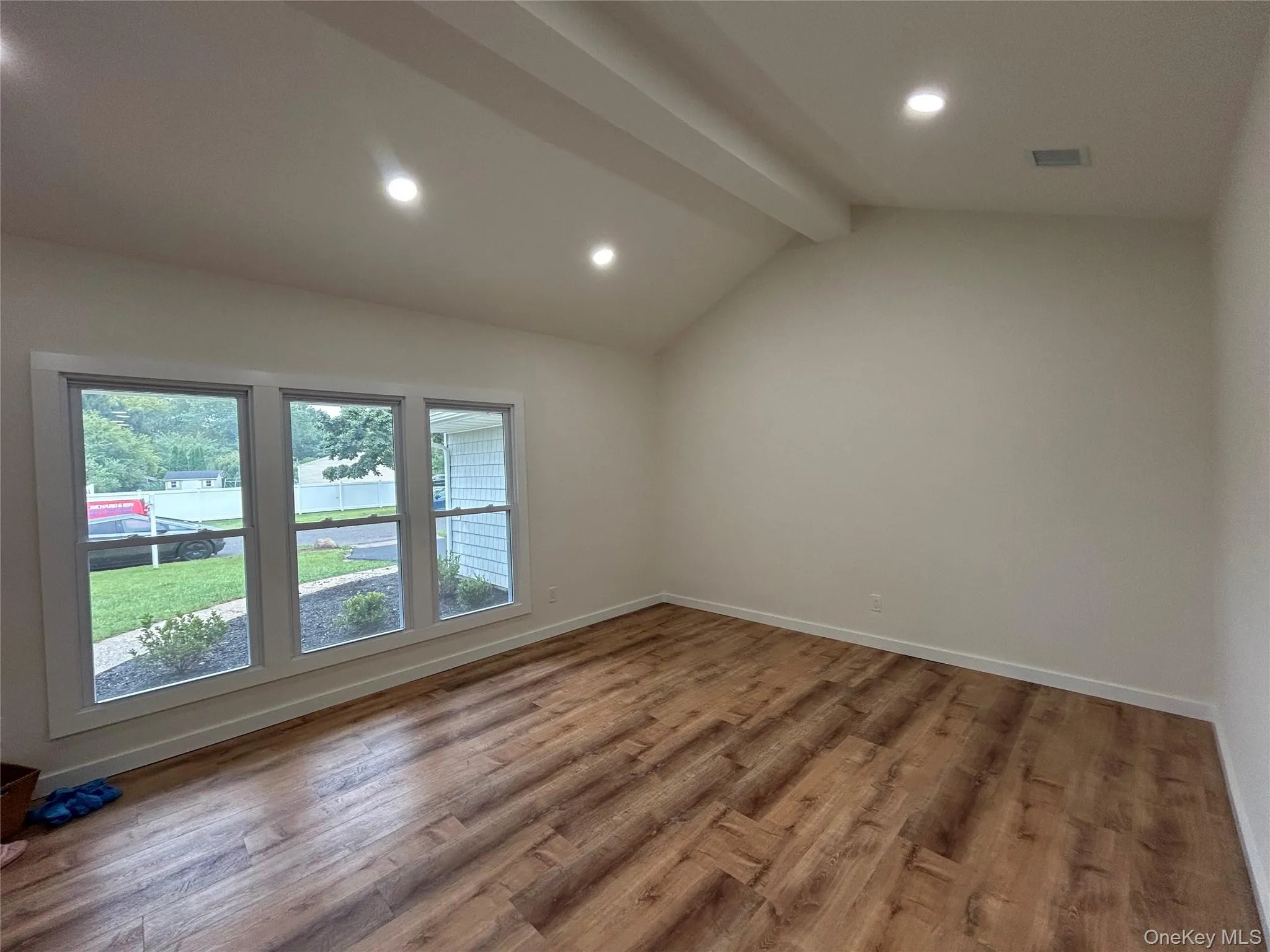 Living Rm with new window, flooring and recessed lighting Living Rm with new window, flooring and recessed lighting