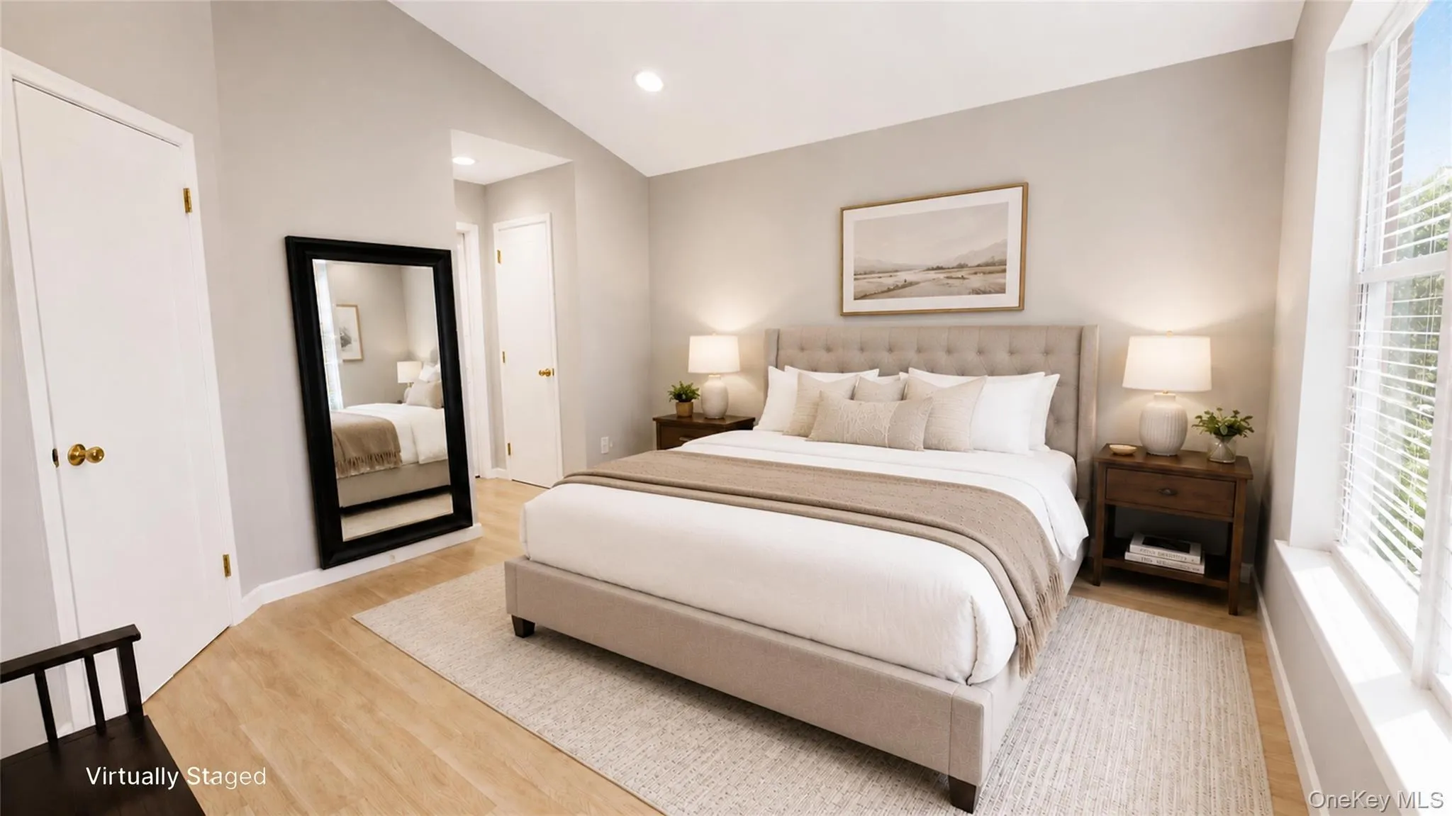 Alternate primary bedroom view highlighting the mounted television, open floor space, and bright windows. Alternate primary bedroom view highlighting the mounted television, open floor space, and bright windows.