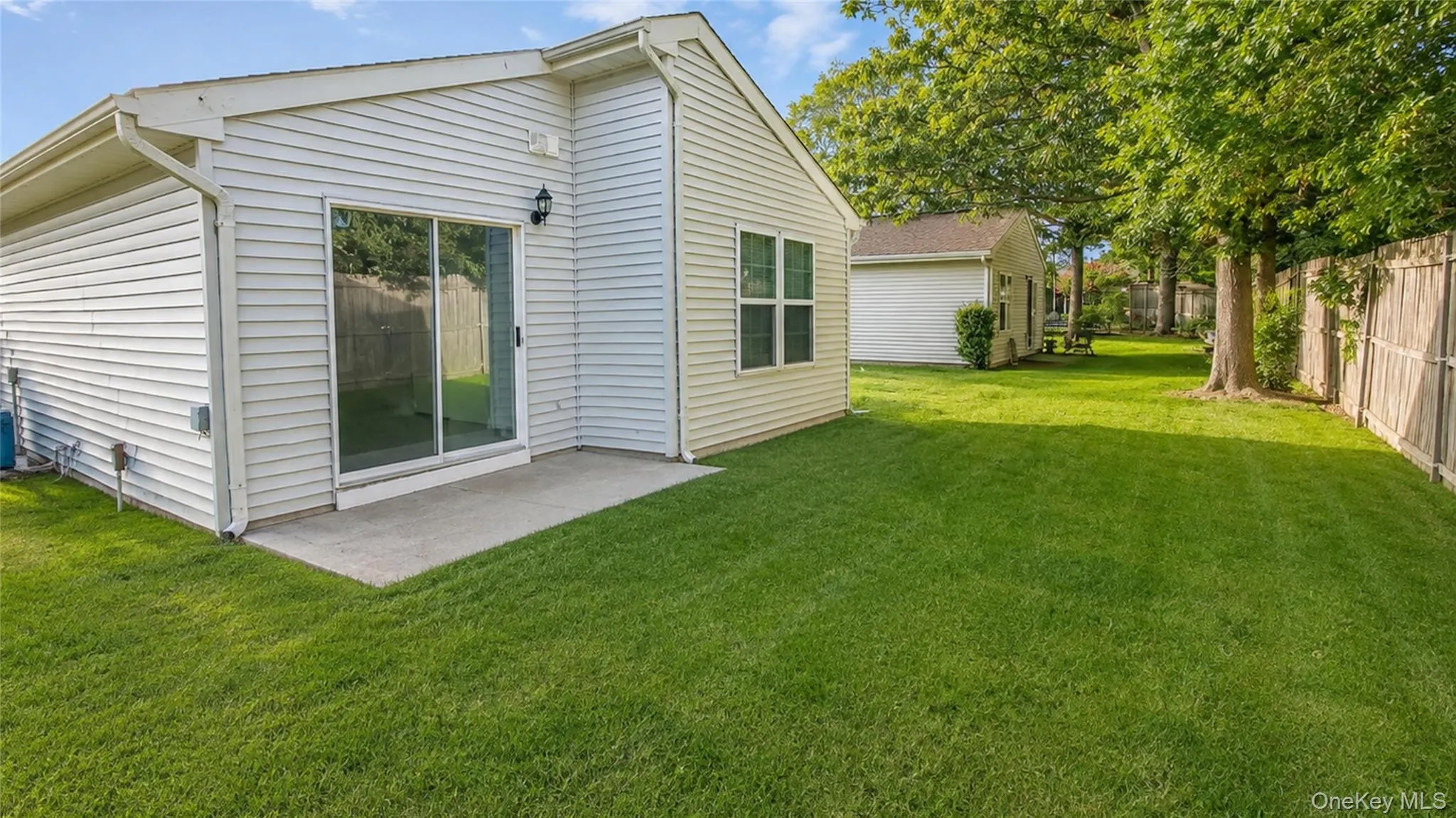 Spacious backyard offering a generous lawn area with direct access from the home and plenty of room for outdoor enjoyment. Spacious backyard offering a generous lawn area with direct access from the home and plenty of room for outdoor enjoyment.