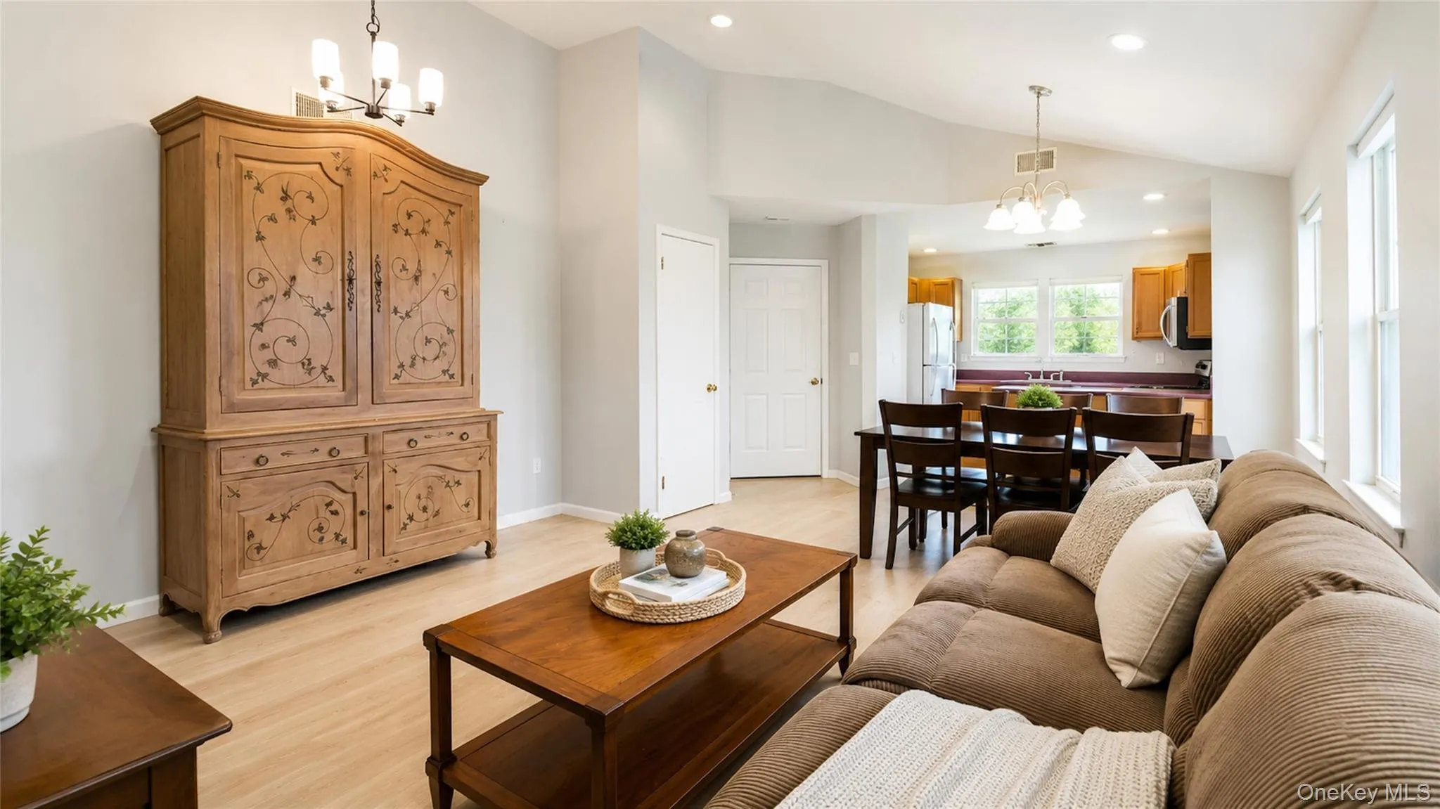 Comfortable and bright living space seamlessly connected to the dining area and kitchen, creating an ideal setting for relaxed everyday living. Comfortable and bright living space seamlessly connected to the dining area and kitchen, creating an ideal setting for relaxed everyday living.