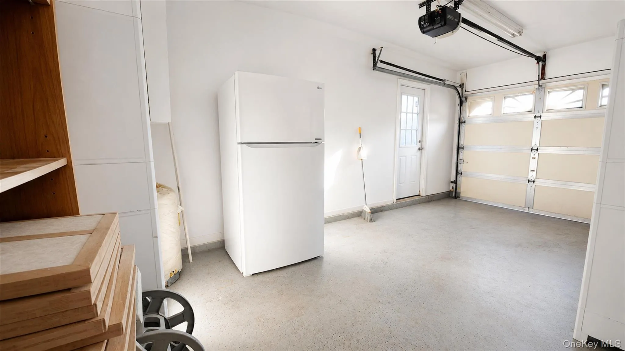 Attached one-car garage providing practical storage, additional utility space, and convenient direct access to the home. Attached one-car garage providing practical storage, additional utility space, and convenient direct access to the home.