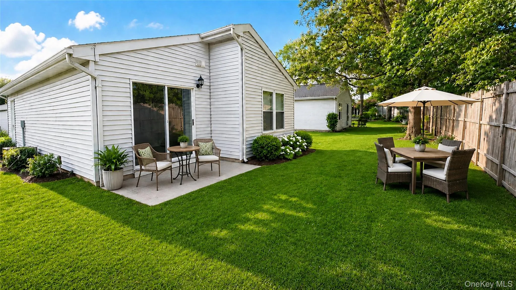 Virtually staged backyard showcasing the potential for outdoor dining, entertaining, and relaxing in a private setting. Virtually staged backyard showcasing the potential for outdoor dining, entertaining, and relaxing in a private setting.