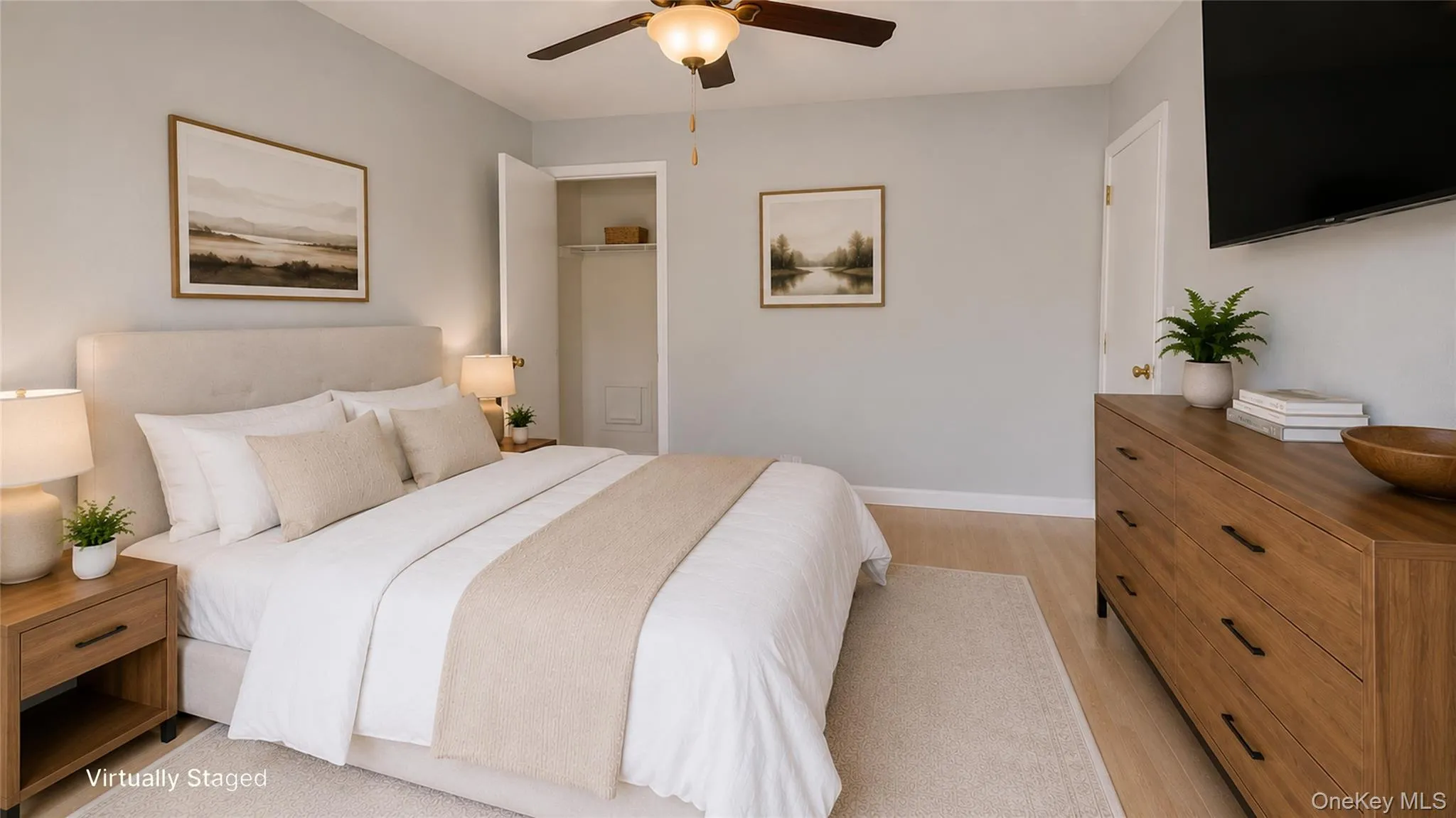 Well-appointed secondary bedroom showcasing ample storage, warm finishes, and a functional layout. Well-appointed secondary bedroom showcasing ample storage, warm finishes, and a functional layout.