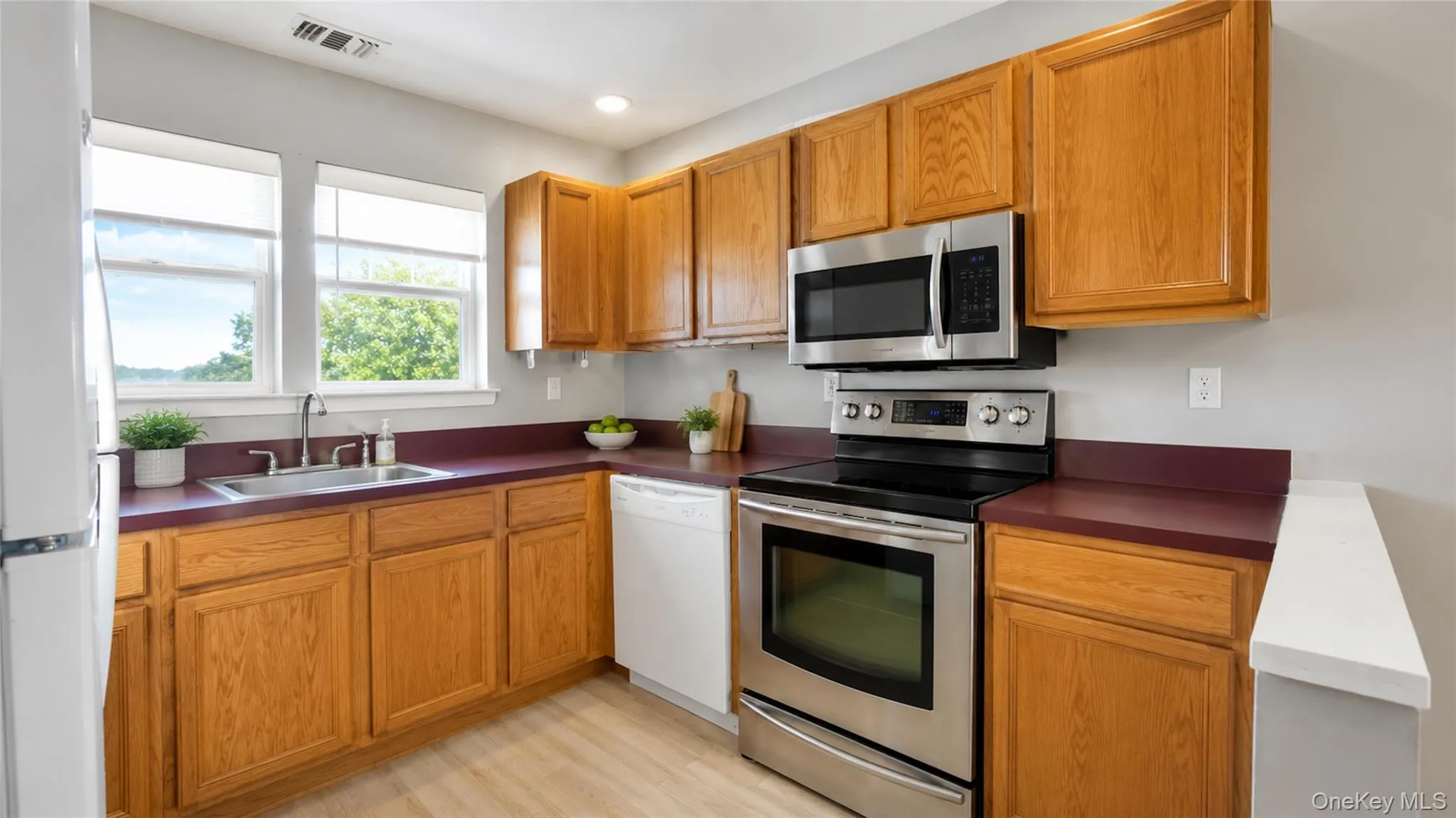 A well-appointed kitchen with warm cabinetry, stainless-steel appliances, and an efficient layout designed for comfortable everyday living. A well-appointed kitchen with warm cabinetry, stainless-steel appliances, and an efficient layout designed for comfortable everyday living.