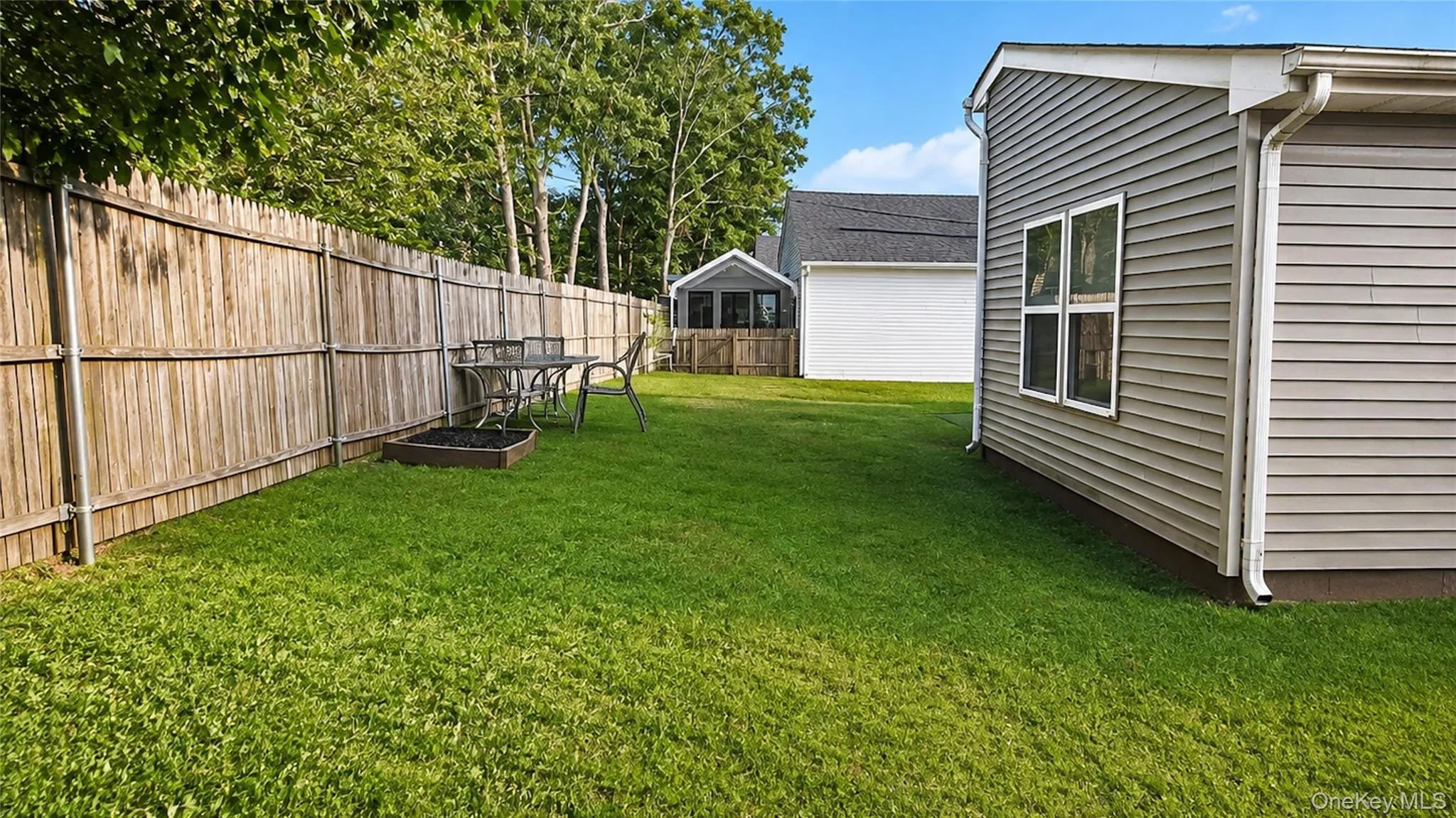 Expansive, level backyard offering a peaceful setting with plenty of room for outdoor enjoyment and entertaining Expansive, level backyard offering a peaceful setting with plenty of room for outdoor enjoyment and entertaining