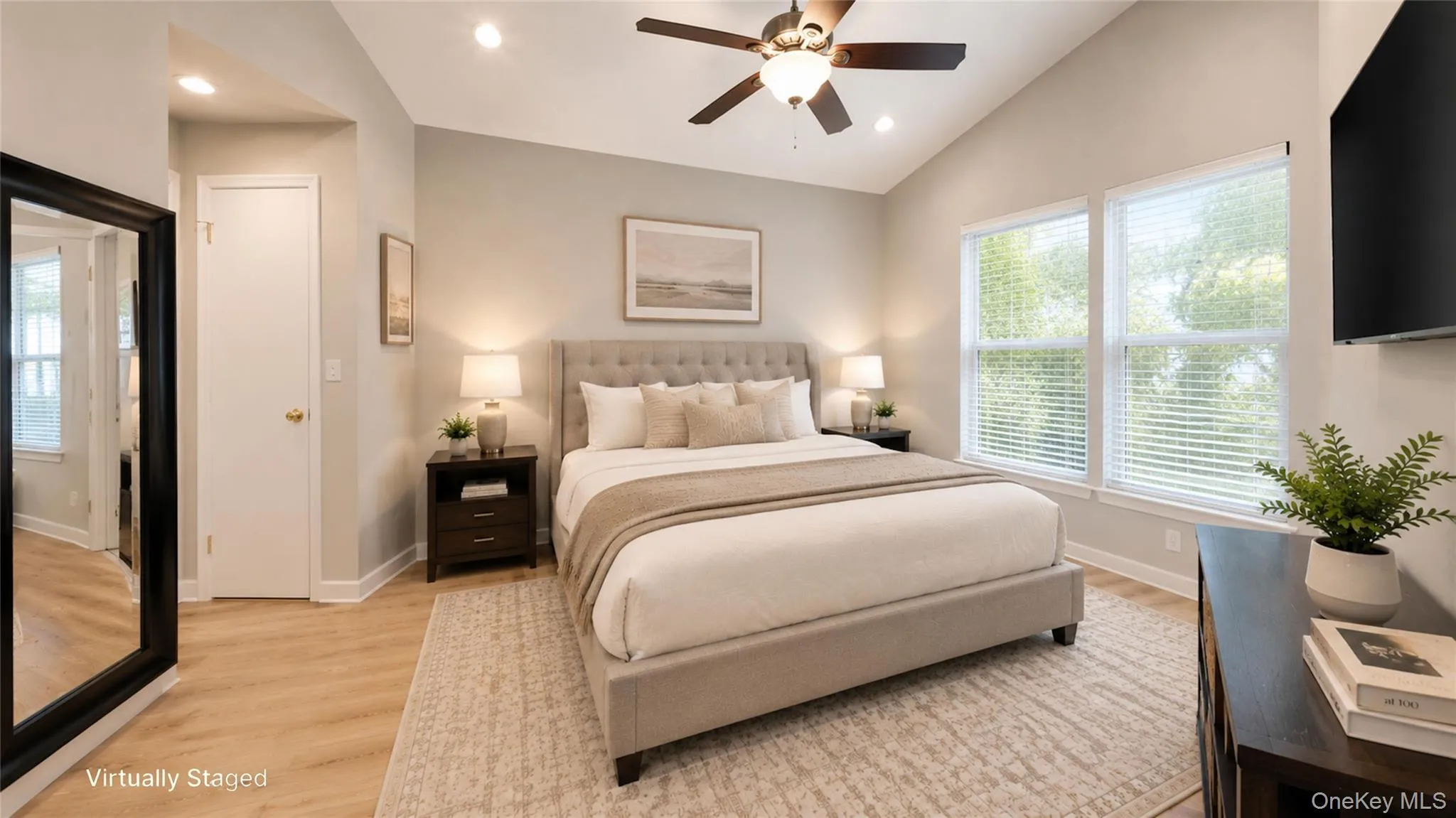 Virtually staged primary bedroom highlighting the room’s generous proportions, abundant natural light, and serene, comfortable atmosphere. Virtually staged primary bedroom highlighting the room’s generous proportions, abundant natural light, and serene, comfortable atmosphere.