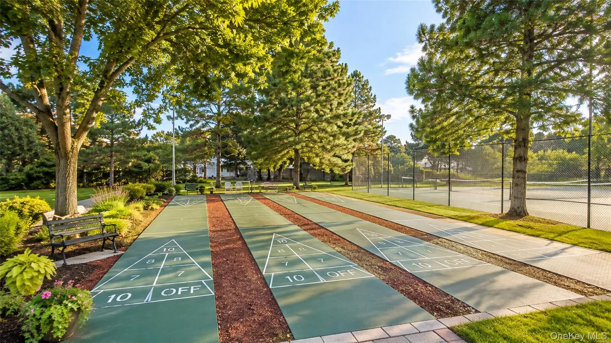 Landscaped shuffleboard courts provide another enjoyable amenity within Greenwood Village’s active community setting. Landscaped shuffleboard courts provide another enjoyable amenity within Greenwood Village’s active community setting.