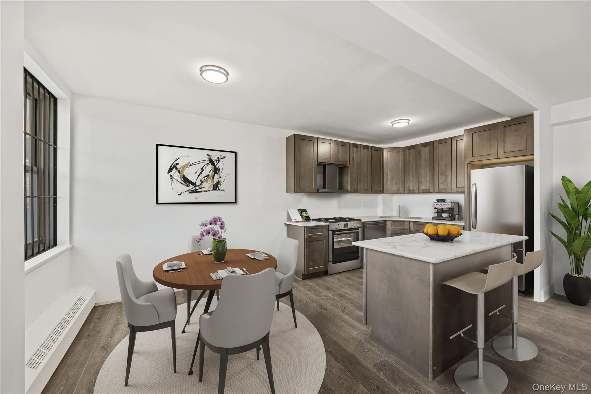 Integrated kitchen and dining area featuring vinyl flooring, white walls, and recessed lighting Integrated kitchen and dining area featuring vinyl flooring, white walls, and recessed lighting