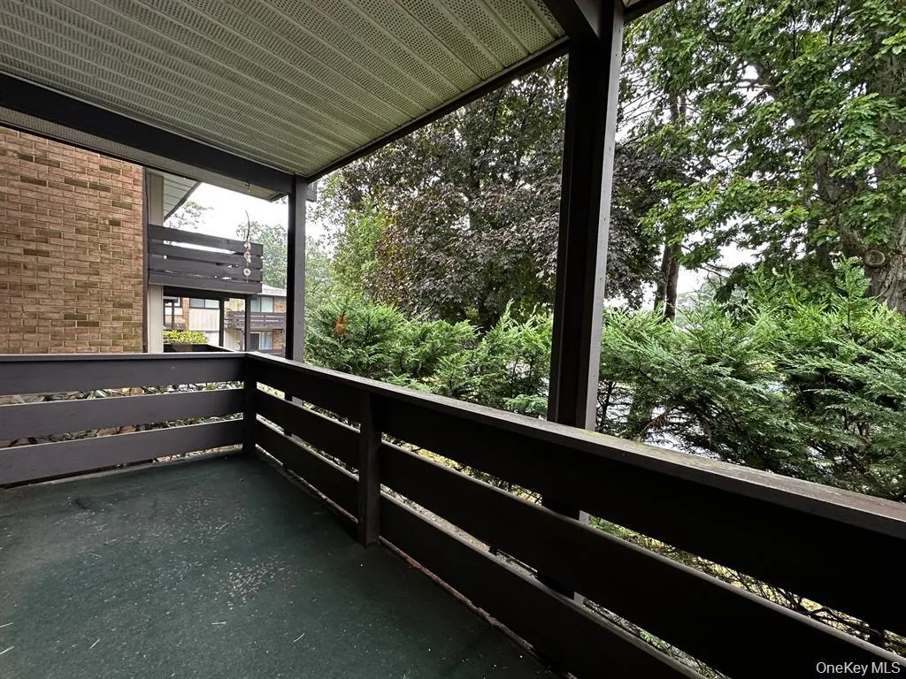 Private covered deck offers a pleasant outdoor space surrounded by mature trees. Private covered deck offers a pleasant outdoor space surrounded by mature trees.