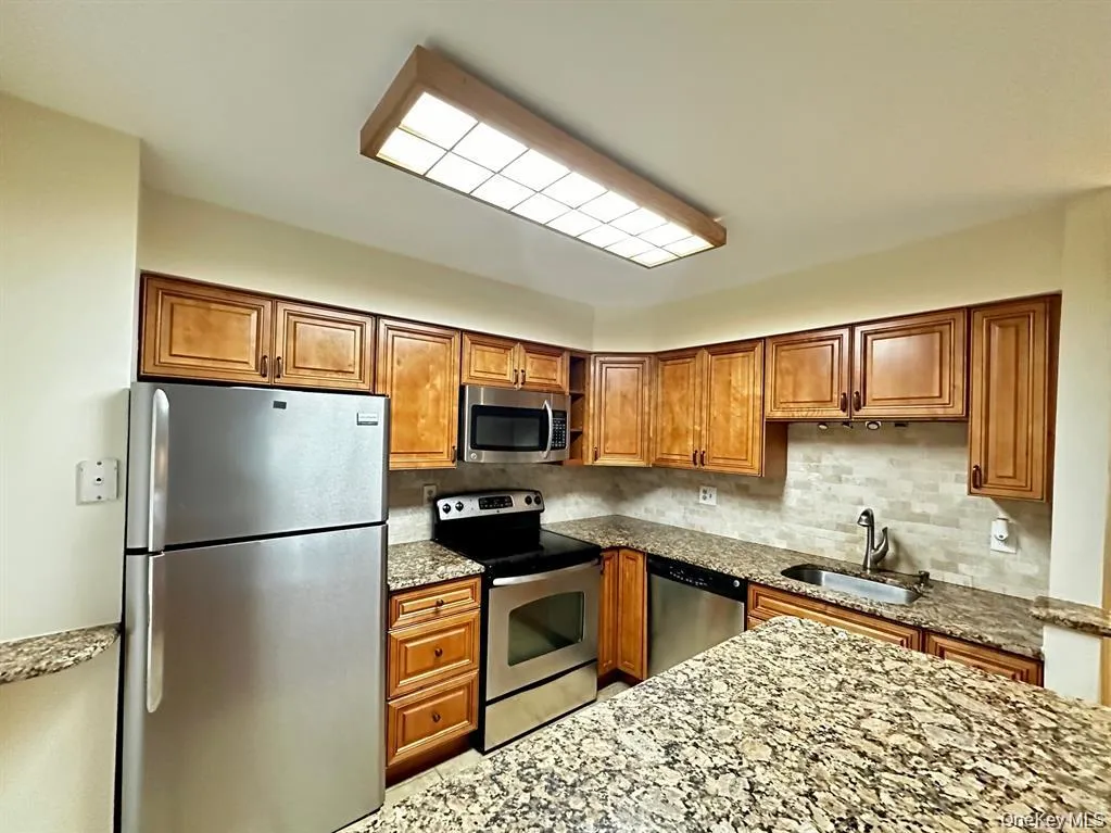 Well-equipped kitchen with plenty of cabinetry and counter space, plus stainless steel appliances. Well-equipped kitchen with plenty of cabinetry and counter space, plus stainless steel appliances.