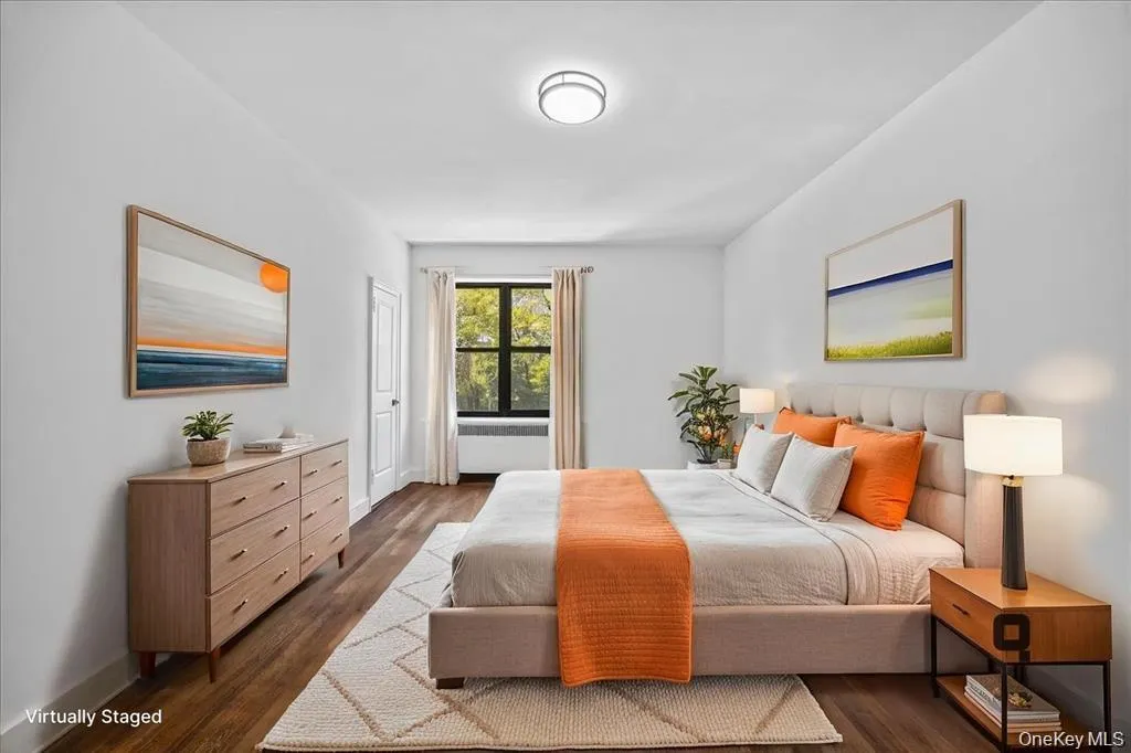 Recessed ceiling lighting, wood-finish flooring, and a large window with natural light Recessed ceiling lighting, wood-finish flooring, and a large window with natural light