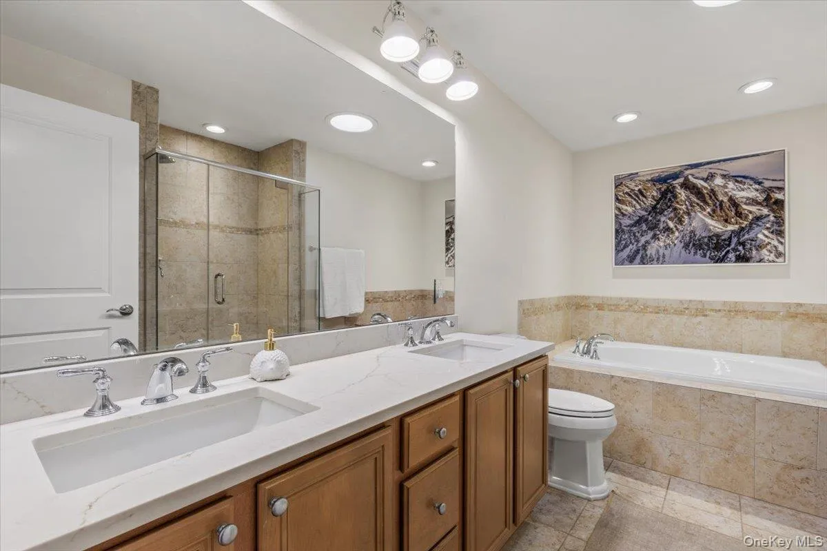 Primary bath with dual vanity and soaking tub Primary bath with dual vanity and soaking tub