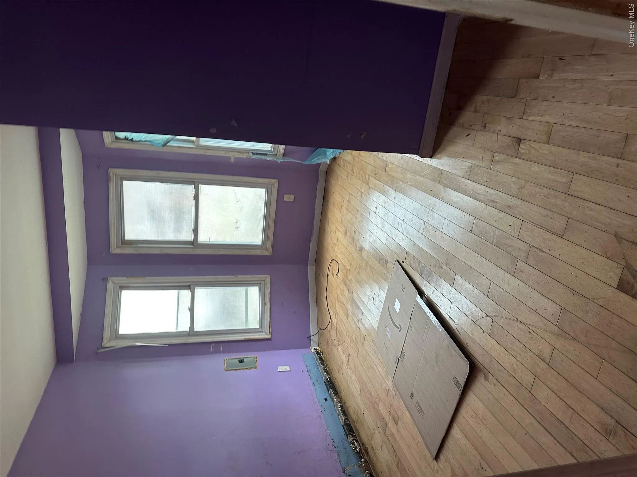 Hardwood flooring with a bay window featuring three individual window units Hardwood flooring with a bay window featuring three individual window units