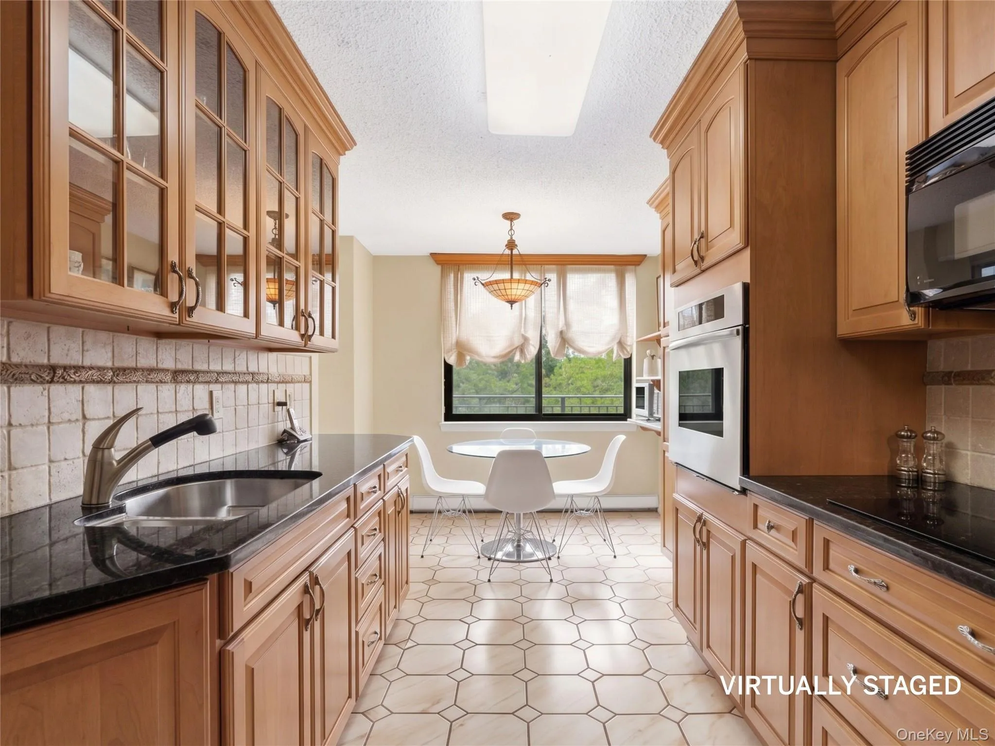 Custom wood cabinetry with granite countertops Custom wood cabinetry with granite countertops