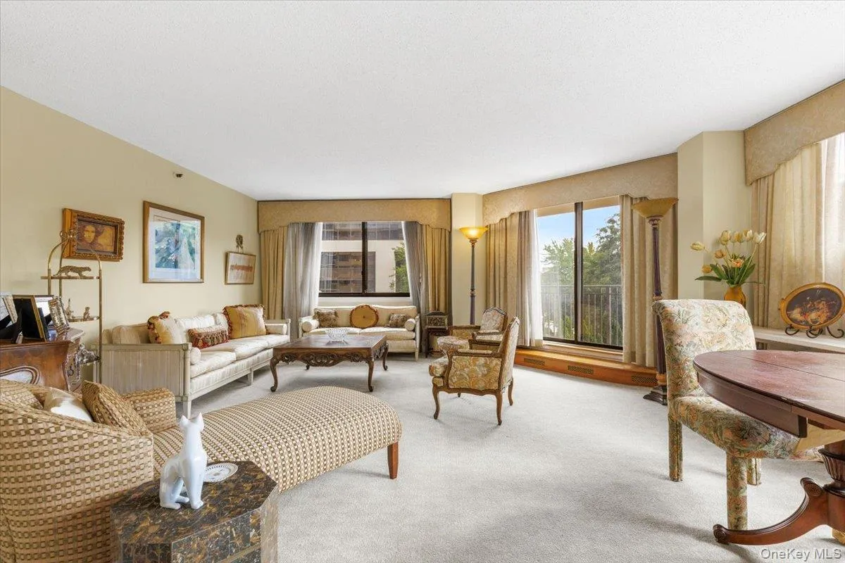 Spacious living area framed by large windows. Spacious living area framed by large windows.