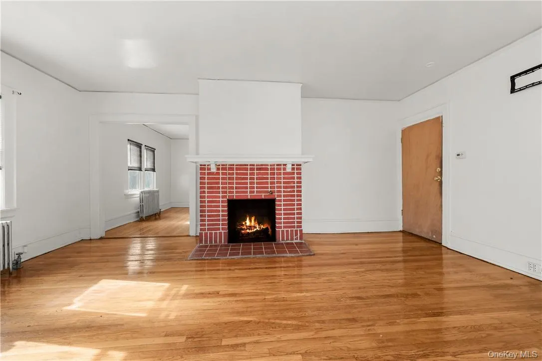 Enter into a sun-kissed living room with non-working fire place. Fire is virtual Enter into a sun-kissed living room with non-working fire place. Fire is virtual