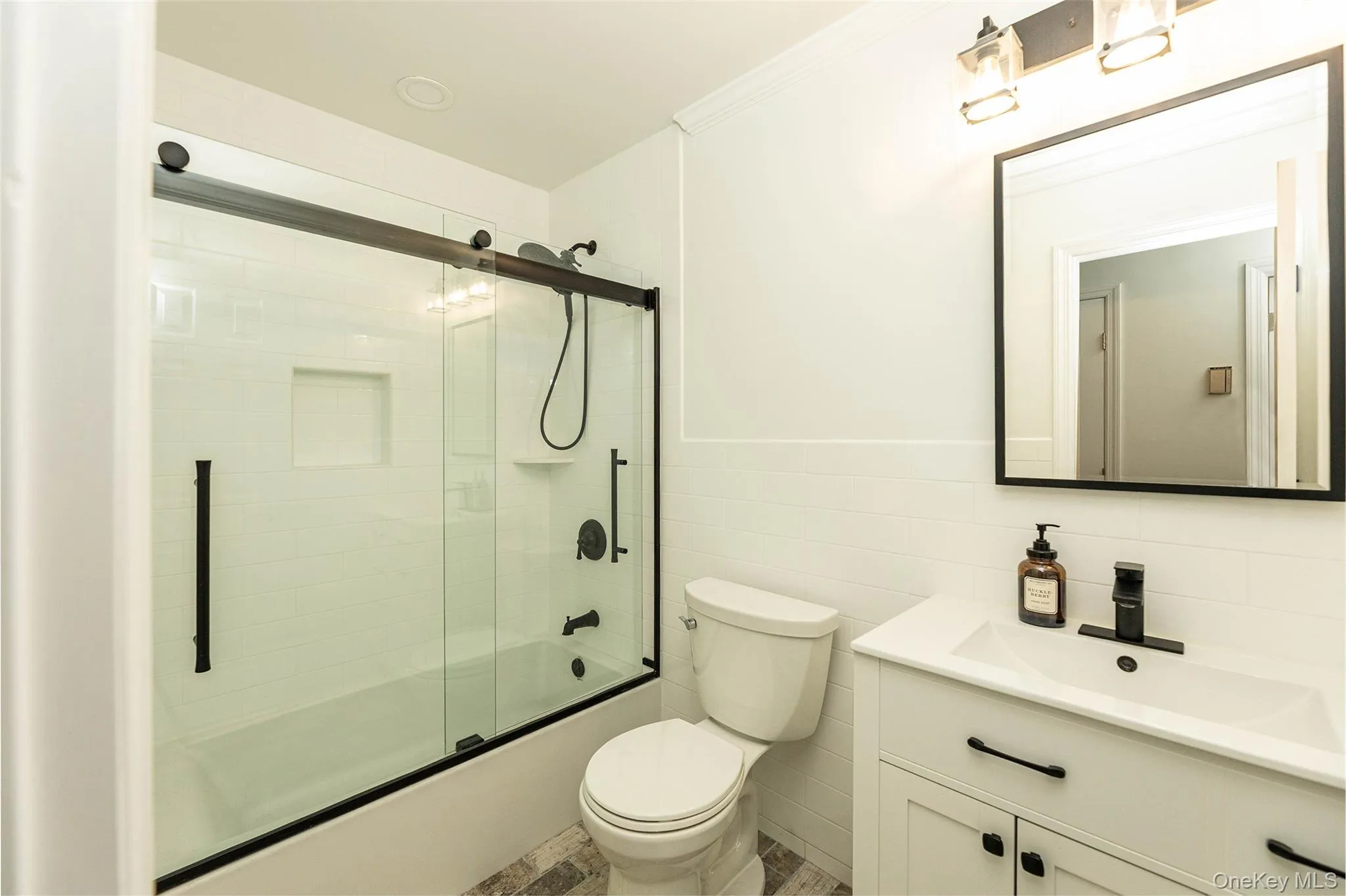 Newly renovated first floor full bathroom. Newly renovated first floor full bathroom.