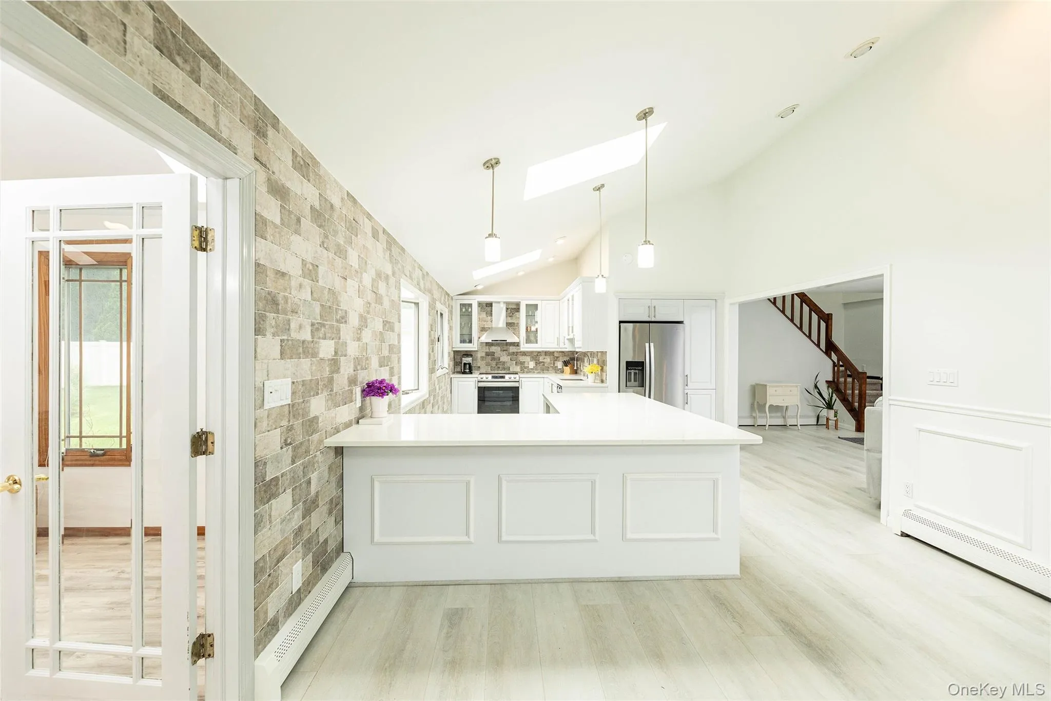 Newly renovated kitchen with quartz countertops and stainless steel appliances. Newly renovated kitchen with quartz countertops and stainless steel appliances.