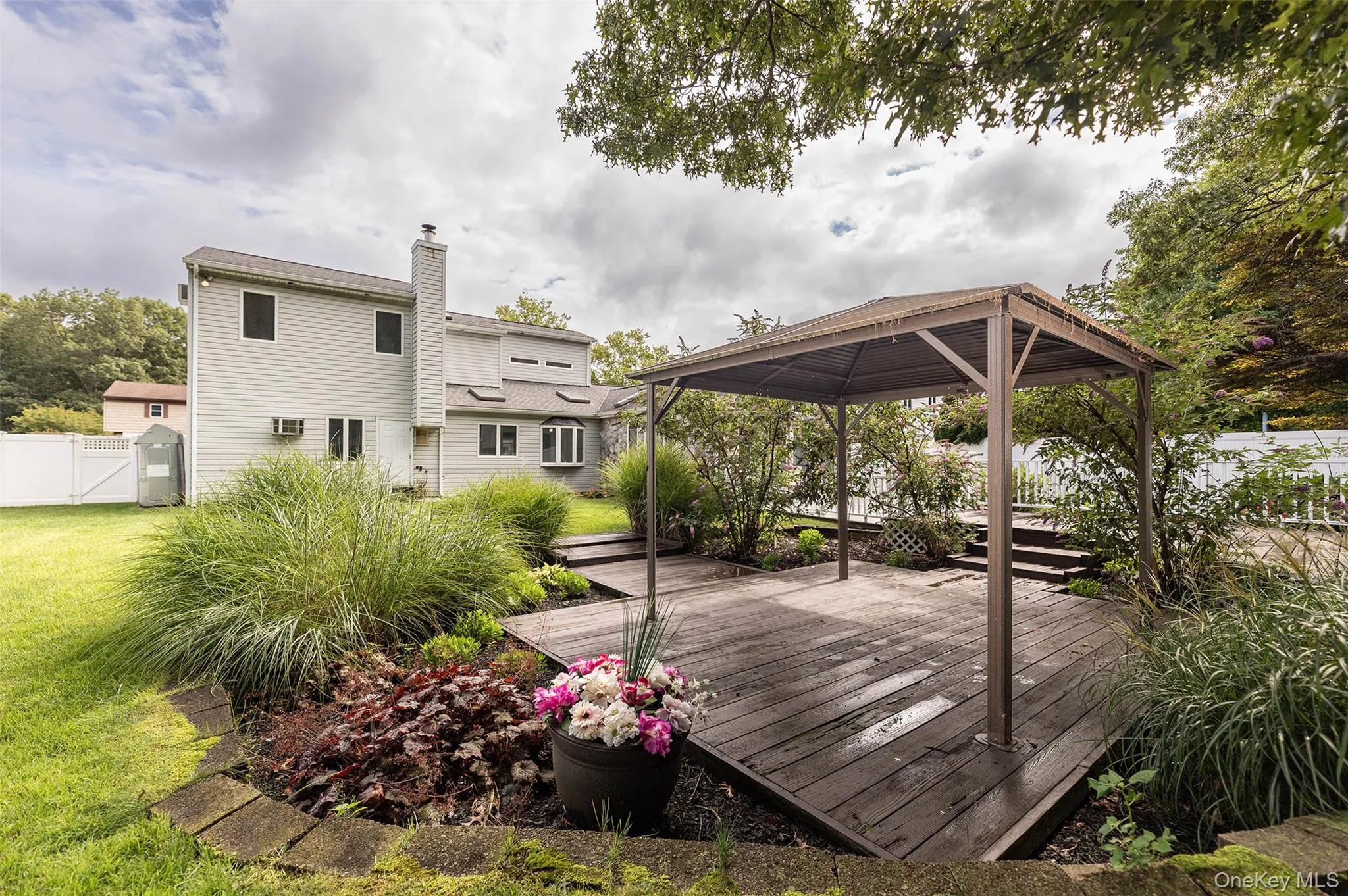 Park like backyard with 3 level deck and gazebo. Park like backyard with 3 level deck and gazebo.