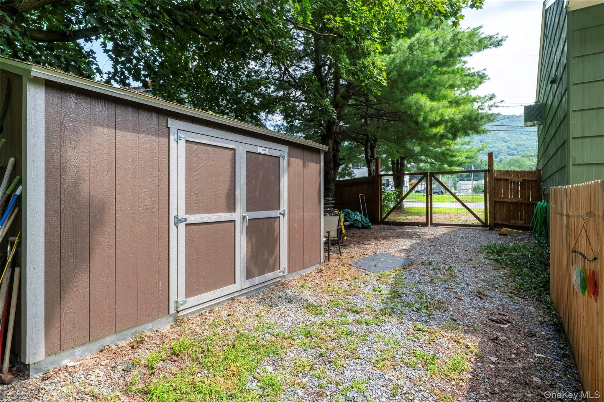 Shed, with gravel area for additional parking. Shed, with gravel area for additional parking.