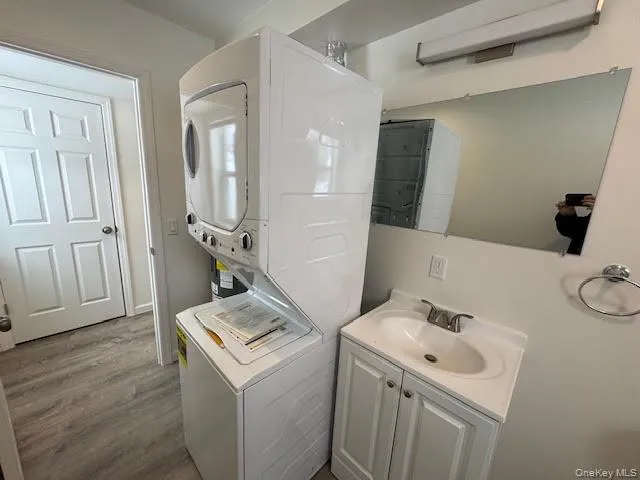 Combination half bathroom and laundry room. Combination half bathroom and laundry room.