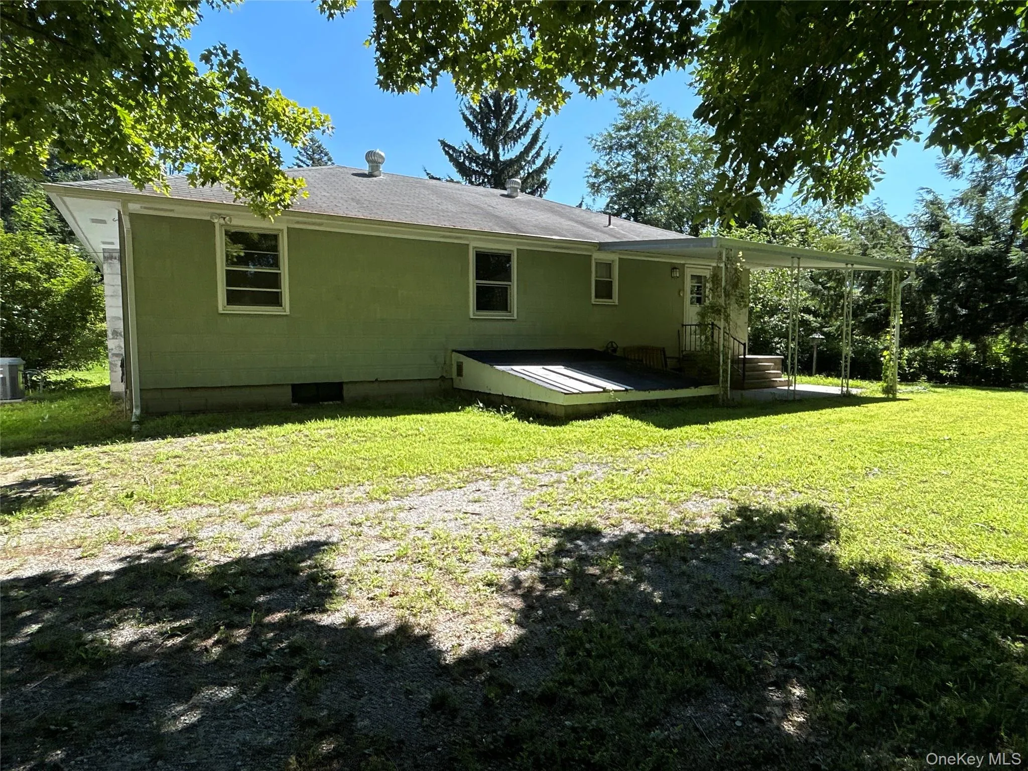 Covered back porch with plenty of parking. One car garage with automatic door opener adjacent to the home. Covered back porch with plenty of parking. One car garage with automatic door opener adjacent to the home.
