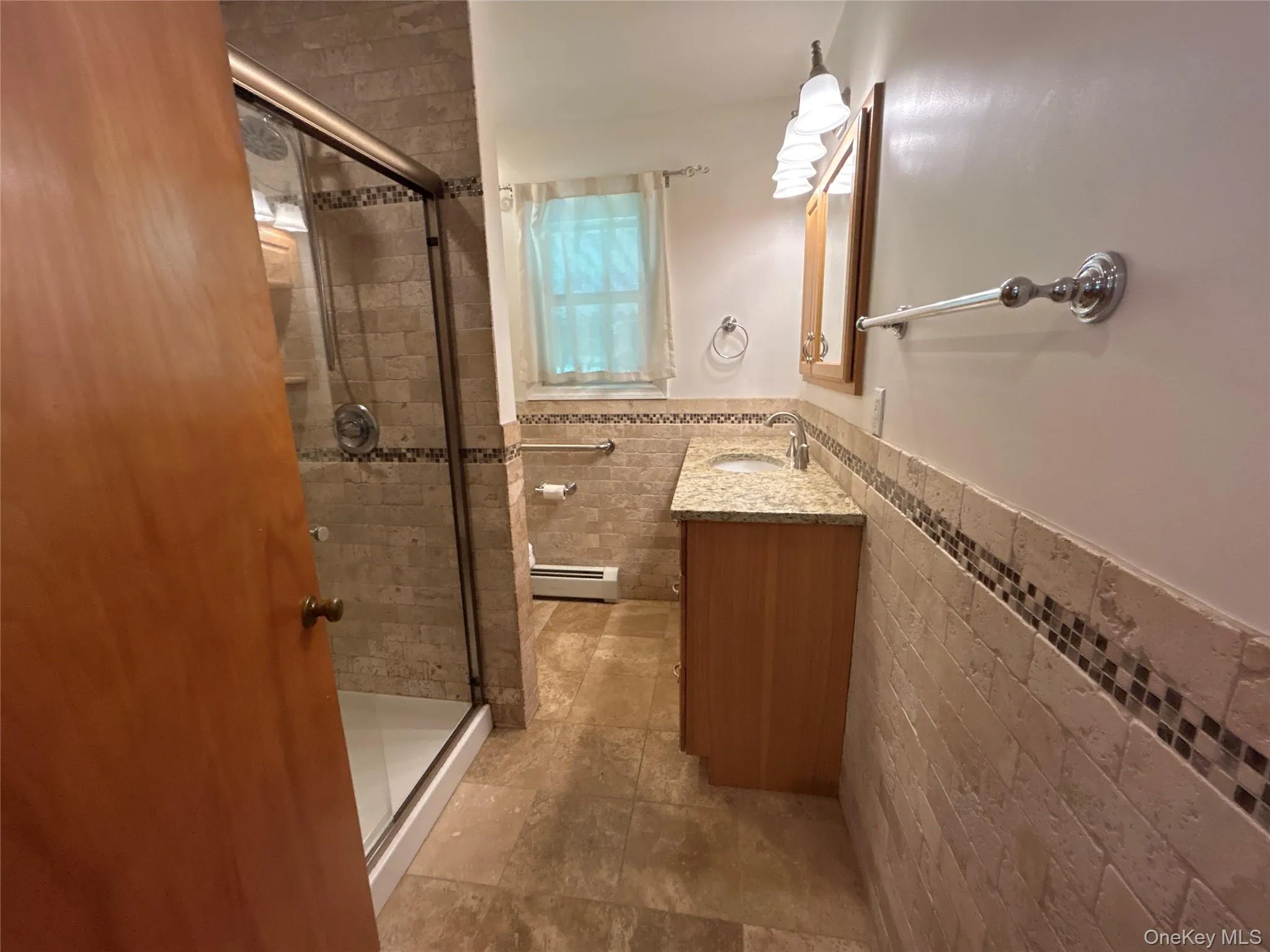 Newer tiled bathroom with shower Newer tiled bathroom with shower