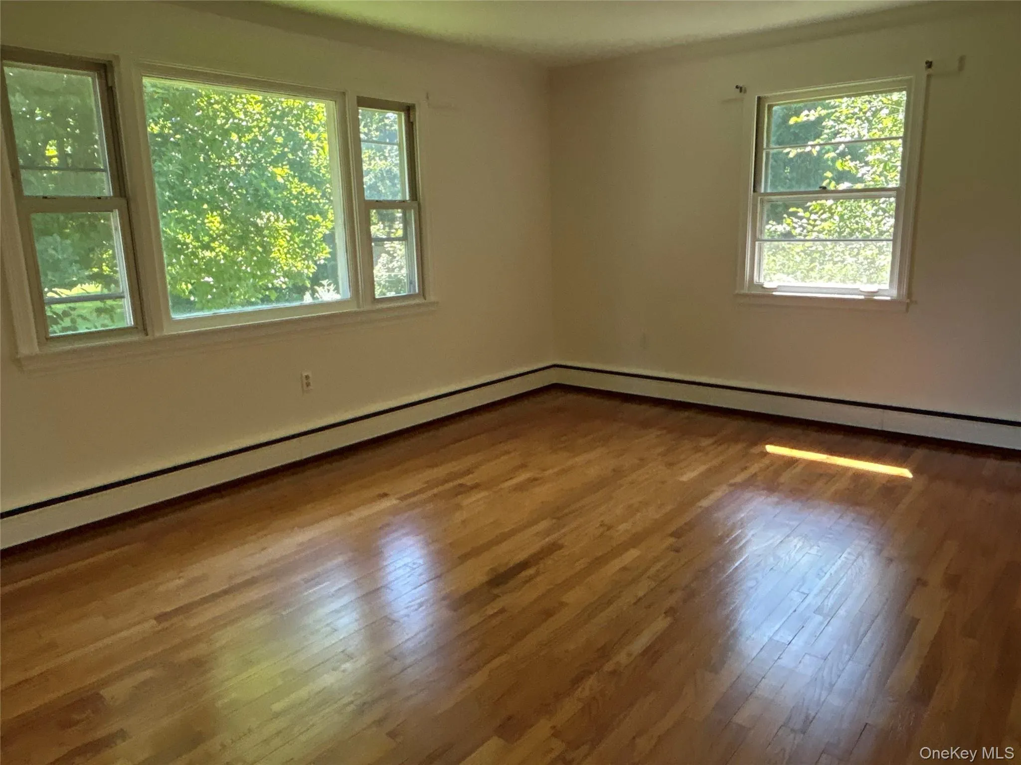 Light and Bright living room with gleaming wood floors Light and Bright living room with gleaming wood floors