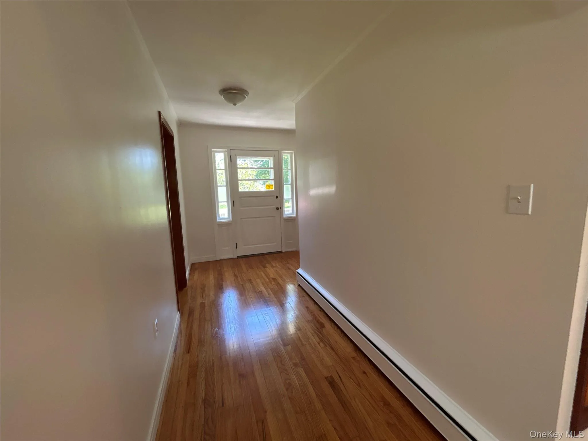 Spacious foyer with large coat closet. Spacious foyer with large coat closet.