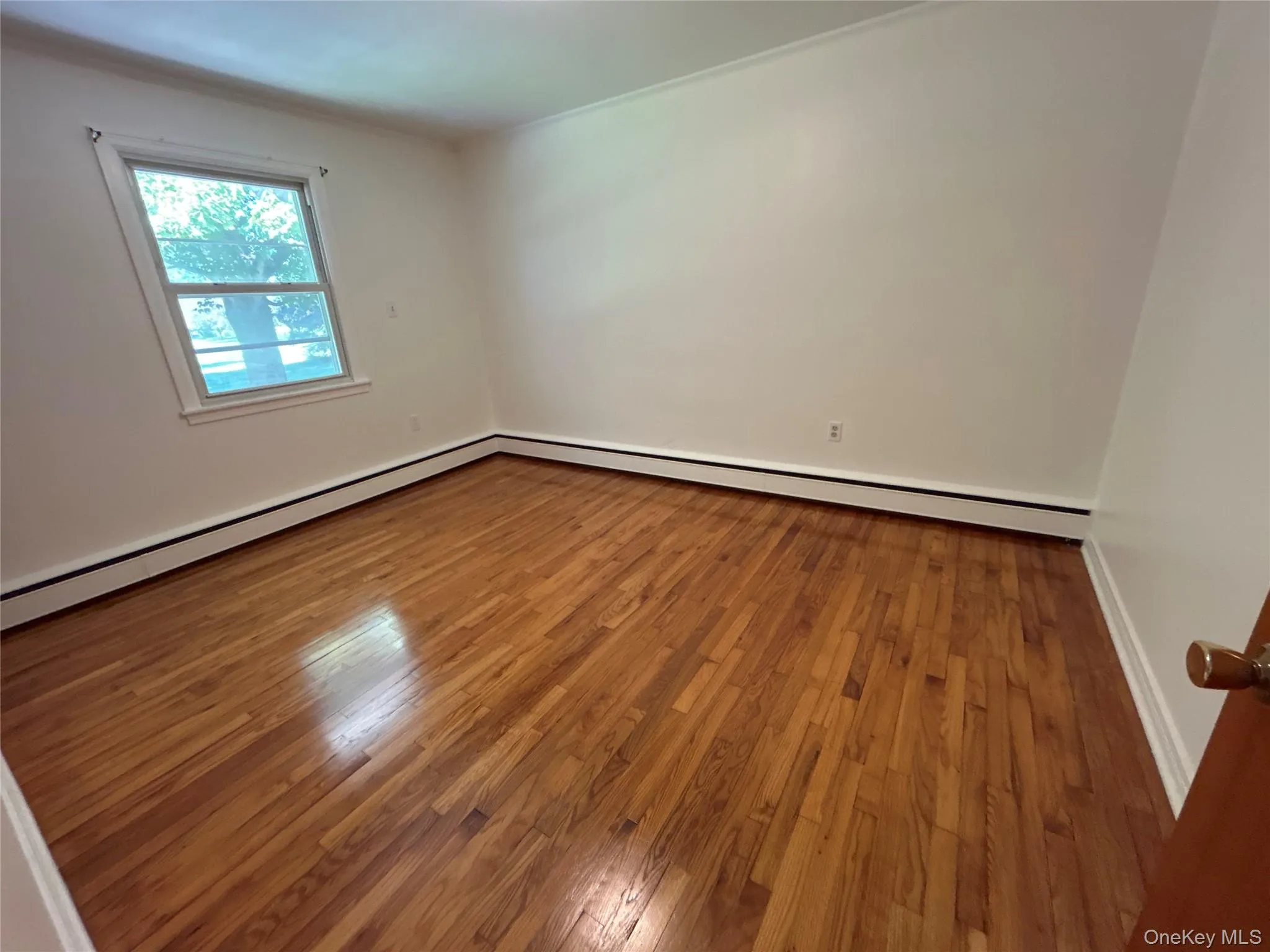 Bedroom #2 with nice wood floors and a generous closet Bedroom #2 with nice wood floors and a generous closet
