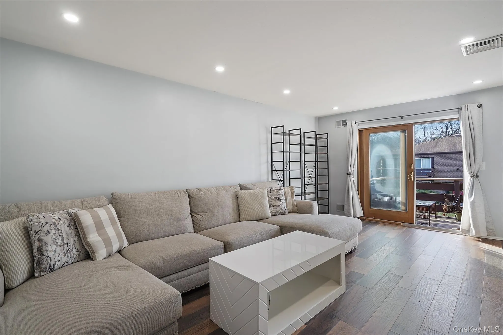 Living room with dark hardwood / wood-style flooring Living room with dark hardwood / wood-style flooring