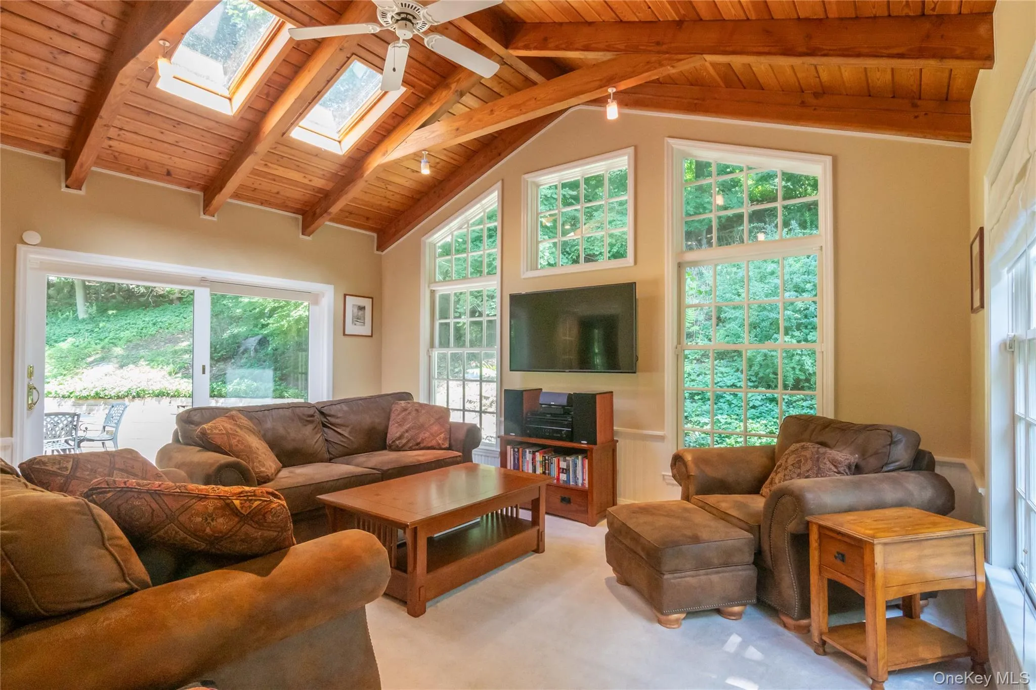 Family Room with Cathedral Ceiling, Skylights and Sliders to the Brick Patio Family Room with Cathedral Ceiling, Skylights and Sliders to the Brick Patio